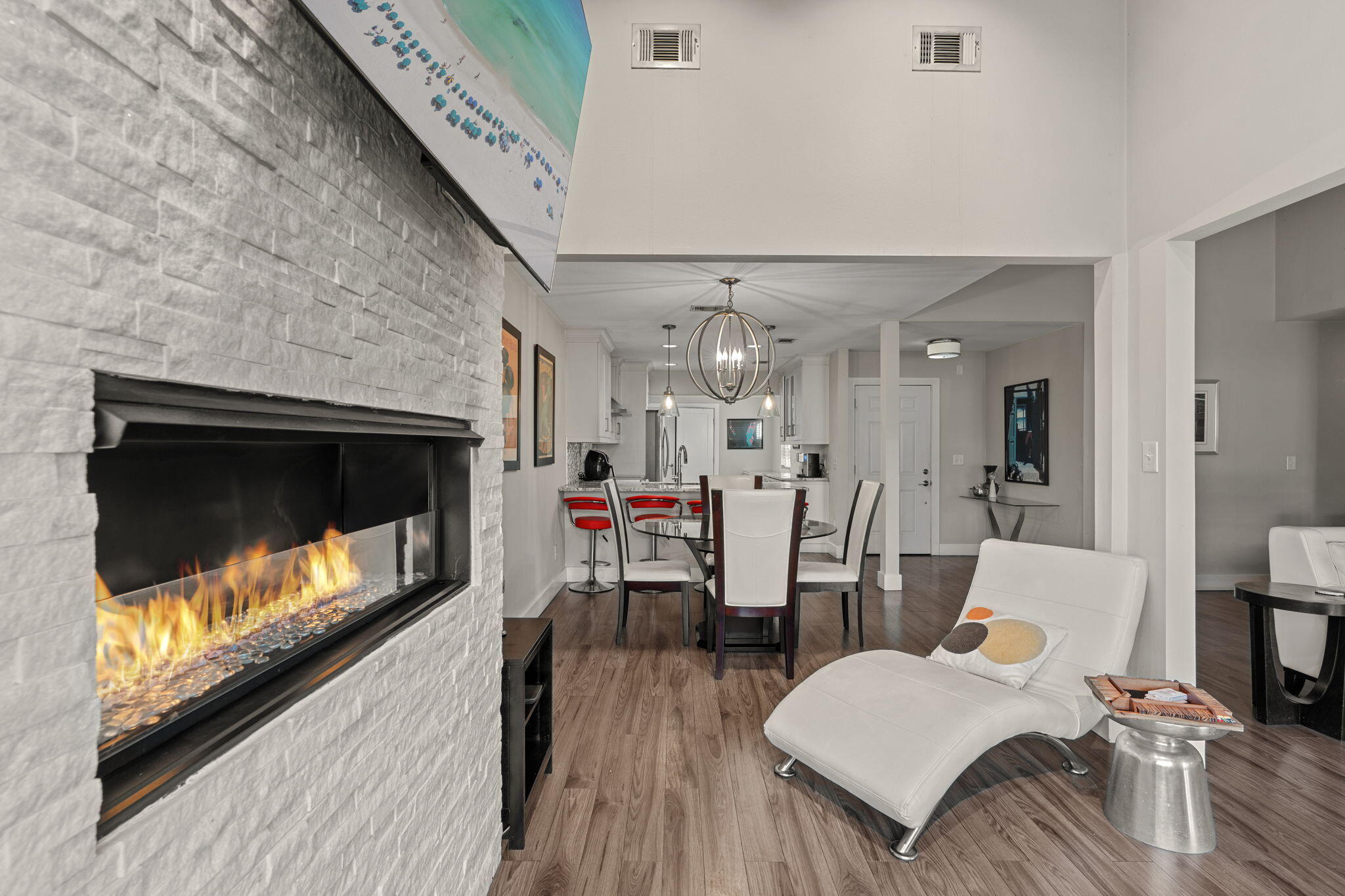 A remarkable opportunity to purchase a renovated, ONE LEVEL, 3-bedroom home  within Sandestin! Artfully renovated and enlarged  for spacious entertainment/living, generous storage room and a quiet location near the community pool.  An abundance of natural light through the new picture window  overlooking the 1st hole of the Links GC with Bay views beyond. A shaded, private patio area, cozy propane fireplace inside and golf cart parking/charging directly in front. Never been rented, meticulously maintained and ready for you! ALL furnishing INCLUDED!  Seller is offering a $10,000 Buyer credit towards closing costs  or what you might imagine! Sandestin Golf and Beach Resort features more than seven miles of beaches and pristine bay front, four championship golf courses, 15 world-class tennis courts, pickleball courts, 108 catch and release ponds stocked with bass (no fishing license required), a 226-slip marina, a fitness center, spa and celebrity chef dining. Shop, dine and play at the charming pedestrian village, The Village of Baytowne Wharf and more. Inside the gates of the resort, residents of the 72 distinctly different neighborhoods enjoy a balanced lifestyle of high-class living, spanning 2,400 acres from the beach to the bay. There are just over 4600 properties within the gates which offer 24 hrs./day gated security. Everything within the gates of the resort is accessible by golf cart or bicycle. The entire resort is interconnected by miles of pedestrian, bike and golf cart paths that weave through groves of live oaks, meandering past natural lagoons, fountains, man-made lakes, and meticulously landscaped fairways.
Just beyond the gates, Grand Blvd with its weekly farmers market, varied events and superb section of dining and shopping is readily accessible by golf cart. The Market Shops, on the south side of highway 98, boasting more dining and shopping choices, is easily accessible utilizing the tunnel beneath Hwy 98