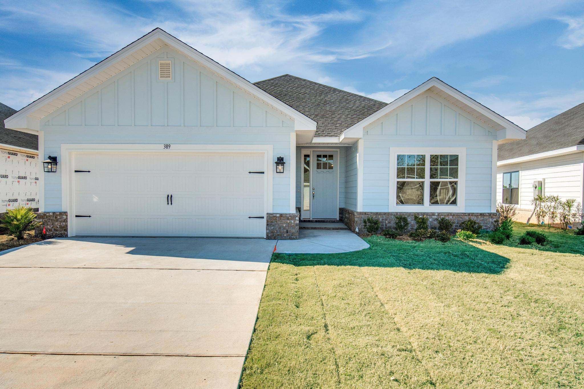This popular Craftsman-style 3BR/2BA home (currently under construction: (Est. August / Sept. N ext to the entrance of the community (next to model). Designed with both comfort and style in mind, the home features HardieBoard® siding with a brick skirt, vaulted ceilings,  and CoreTec Pro Plus luxury vinyl plank flooring throughout--no carpet. The spacious primary suite boasts elegant tray ceilings, a generous walk-in closet, and a spa-inspired bath. Quartz countertops in the kitchen and baths, soft-close cabinetry, spacious covered patio complete this inviting home, perfect for relaxed everyday living and entertaining. Bluffs residents enjoy a community pool, and bathhouse, near the Florida Trail offering plenty of opportunities to get outside and enjoy the Florida life style.  *Pics are of a similar home.*