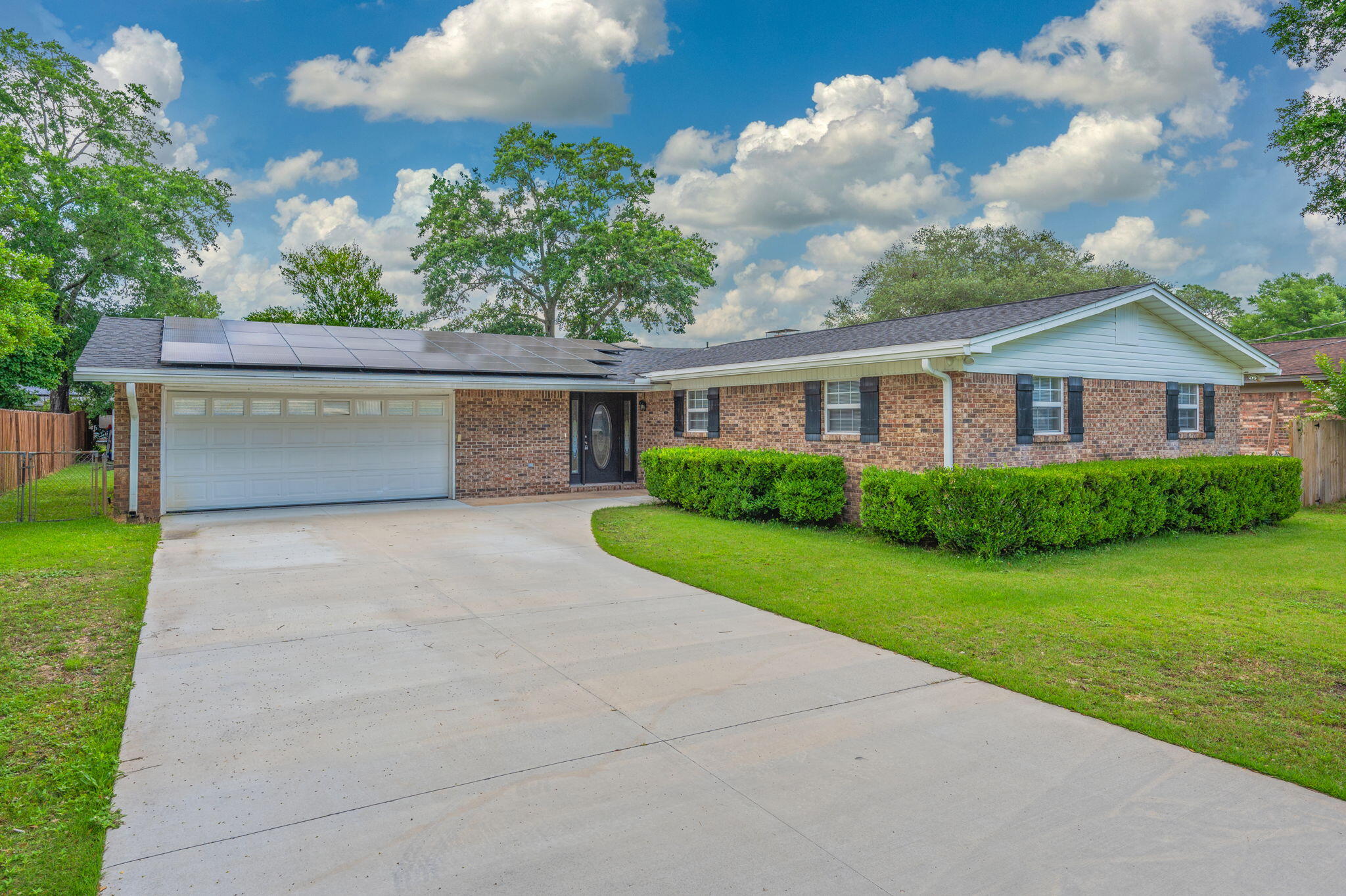 Welcome to this charming all-brick single-family home featuring luxury vinyl plank flooring, a fully updated kitchen with stone countertops, stainless steel appliances and upgraded cabinetry. The spacious master suite offers a custom walk-in shower and two wardrobe closets. The home also features 3 large guest bedrooms and a generously sized guest bath with a dual vanity and tile surround bath/shower combo. Enjoy the convenience of an included washer and dryer, a large fenced-in backyard--perfect for outdoor living--and a cooled two car garage for year-round comfort. Monthly electric/solar fee applies. Don't miss out on the opportunity to rent this PRIME rental home...contact us today for a showing!!