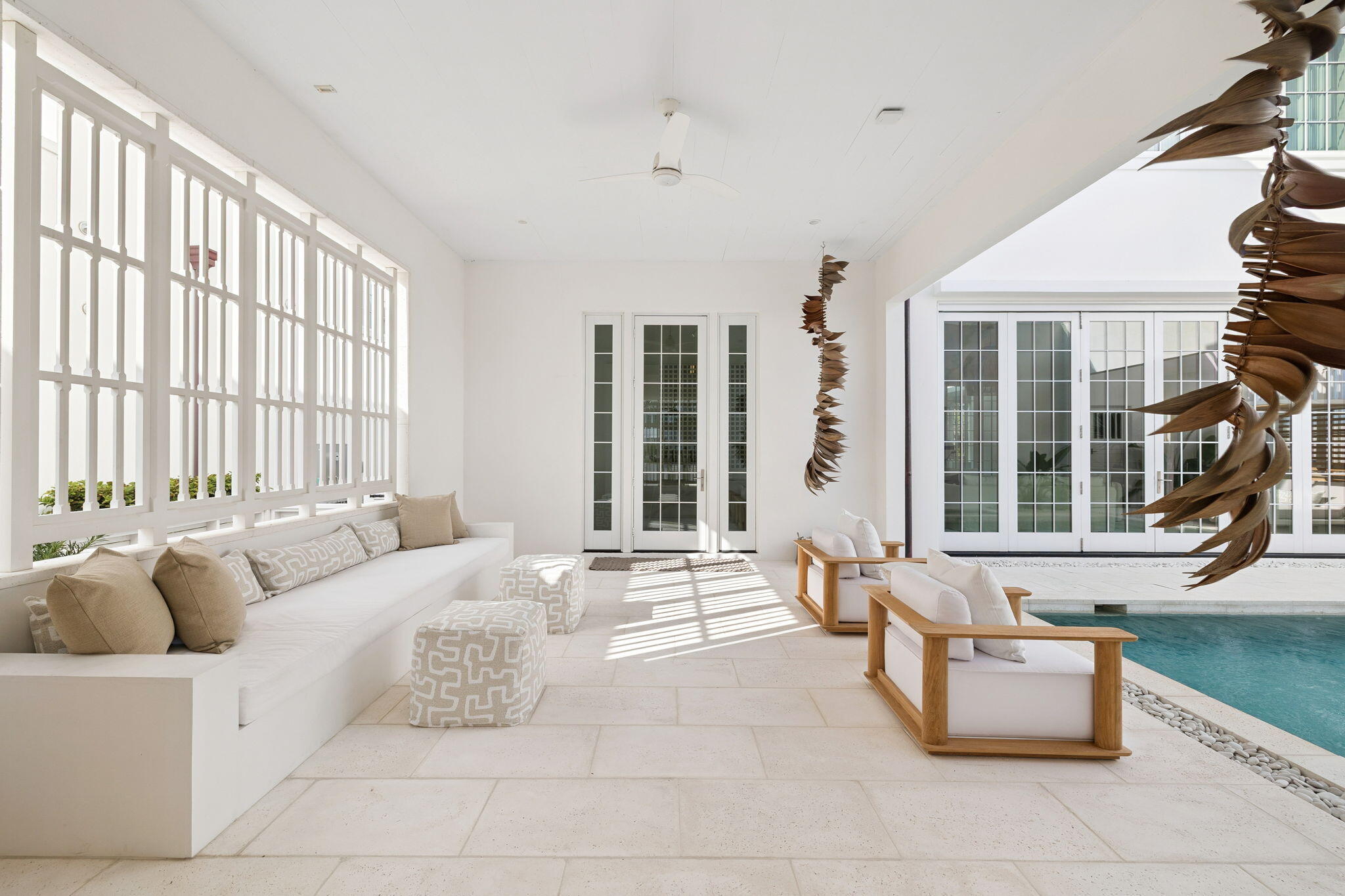 Experience refined coastal living at 53 Portico Lane, a SummerStory Showcase Home in the coveted Kaiya Beach Resort. Architecture by Khoury & Vogt Architects (KVA), thoughtfully featured in collaboration with the nationally acclaimed boutique, SummerStory, this 4,414 sq ft retreat offers 4 bedrooms + bunk and game areas, 5.5 baths, and an inviting bedroom suite on the main level. The home's private courtyard reveals a serene pool, spa, and fully equipped summer kitchen, while interiors feature Wolf and Sub-Zero appliances, Waterworks fixtures, and curated finishes.  Framed by preserve views, every element speaks to timeless elegance and elevated coastal design. Spaces designed for living with generous closets, a flex space on floor two and dual sinks in the ensuite bathrooms. Close proximity to the beach with deeded beach access and usage. Kaiya Beach Membership is available as well as the nearby Watersound Camp Creek Golf and Beach Club.  53 Portico offers an urban lifestyle while still maintaining a respite from the hustle and bustle.