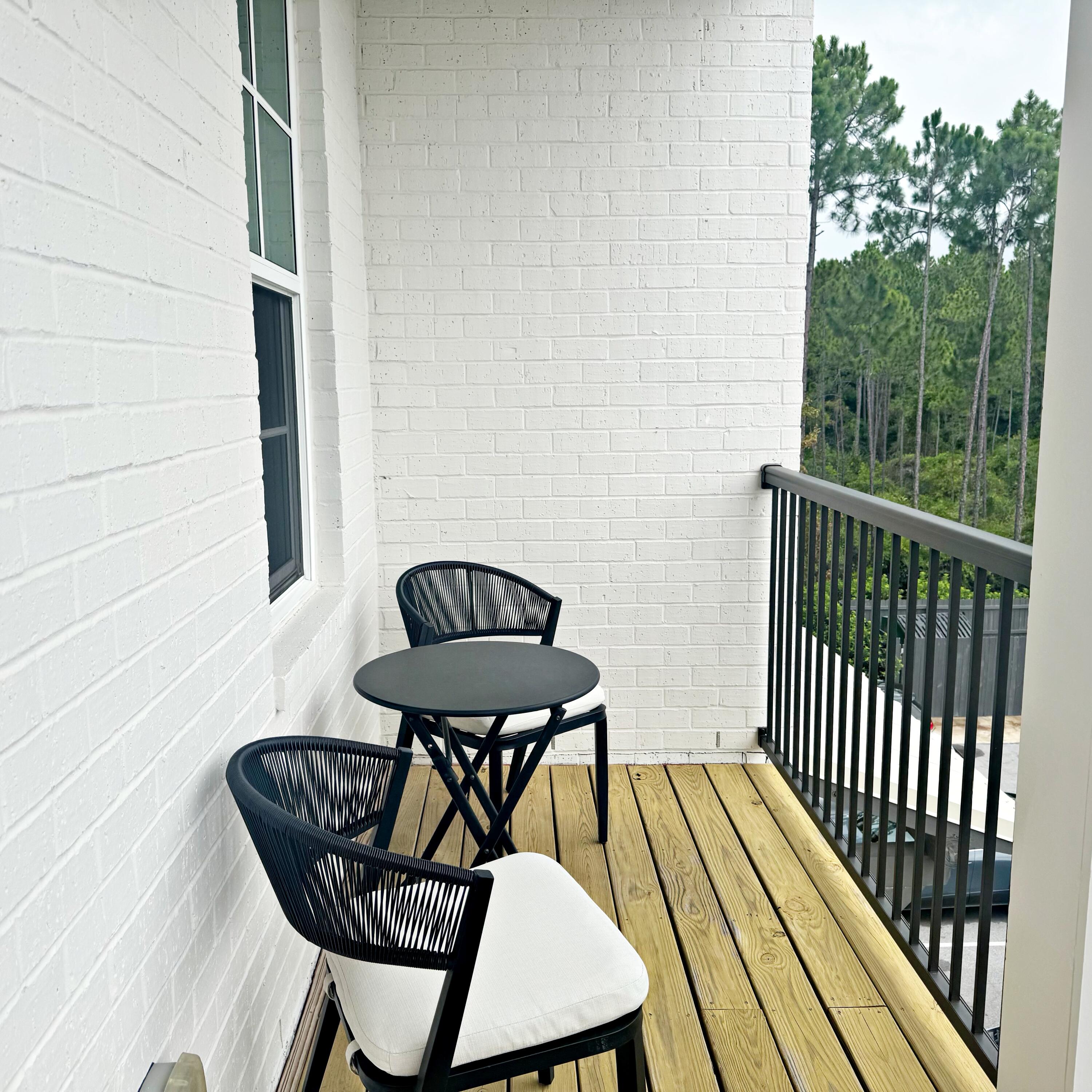 Welcome to Pinewood 30A, where modern comfort, investment flexibility, and the relaxed South Walton lifestyle come together. This third-floor, one-bedroom, one-bath condominium offers 837 square feet of thoughtfully designed living space with luxury vinyl and tile flooring, high ceilings, quartz countertops, white shaker-style cabinetry, stainless steel appliances, a spacious walk-in closet, and a private balcony overlooking the community pool area.

The open kitchen features generous countertop and cabinet space, a tile backsplash, range hood, and modern appliances. The spacious bedroom offers room for a desk or sitting area, making the residence equally comfortable as a primary home, second home, or rental property.

Short-term rentals are permitted, subject to current association and governmental requirements. The seller reports current rental income of $2,000 per month and no pending special assessments. Pinewood 30A amenities include a resort-style community pool, fitness center, community room, elevators, gated access, and convenient proximity to Scenic Highway 30A, local dining, shopping, trails, and the beaches of South Walton.

One assigned parking space is included. An optional covered parking space may be available for an additional $10,000, subject to separate agreement and confirmation of transfer rights. Rental information, lease terms, association documents, and property details are available for buyer review.