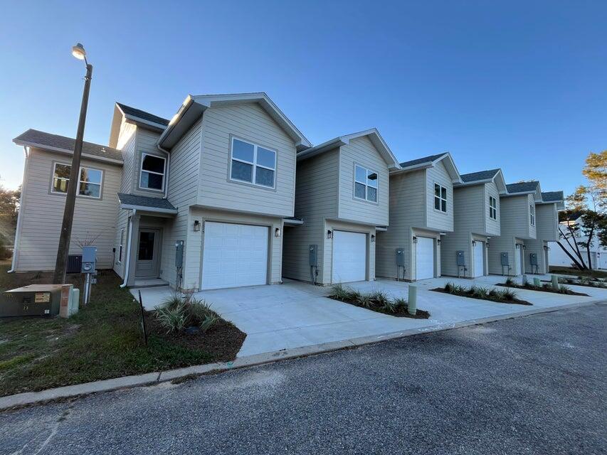 Experience modern coastal living in this stunning new construction 3-bedroom, 2.5-bath townhome located in the desirable Hidden Bay Village. This beautifully designed two-story home offers an open-concept layout with soaring ceilings, expansive windows, and a full-length glass panel door that leads to the backyard--filling the space with abundant natural light and creating a bright, airy atmosphere.

The kitchen is thoughtfully upgraded with sleek appliances, granite countertops, and ample cabinetry, making it perfect for both everyday living and entertaining. Upstairs, the spacious primary suite serves as a private retreat, featuring a walk-in closet, dual vanities, a relaxing soaking tub, and a separate walk-in shower with dual shower heads for a spa-like experience.

For added convenience, a stacked washer and dryer are located on the second floor, making laundry effortless. The attached one-car garage provides secure parking along with extra storage space. Lawn care is included, allowing residents to enjoy a well-maintained exterior without the added responsibility of yard upkeep.

Enjoy a lifestyle of comfort and recreation with easy access to a nearby golf course and East Bay, ideal for boating and fishing. The community pool has been recently renovated and features a brand-new pool deck, just steps from your covered patio. Residents also enjoy exclusive beach access within half a mile--perfect for taking in peaceful bay views and unwinding by the water.

 This exceptional townhome offers the perfect blend of luxury, convenience, and coastal charm.

Pets may be considered on a case-by-case basis with owner approval and a non-refundable pet fee. This is a non-smoking property, and vaping is not permitted.