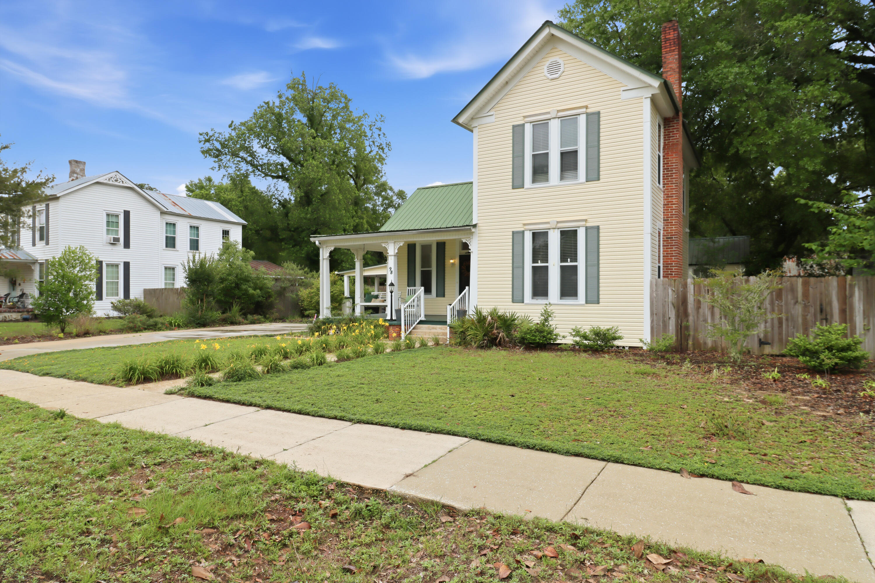 Step into a piece of history in the heart of DeFuniak Springs, where timeless character and Southern charm come together in this beautifully preserved historic home. Nestled beneath mature trees, this inviting property offers the perfect blend of warmth, charm, and classic craftsmanship. Located just a few blocks from the iconic lake yard, local coffee shops, restaurants, boutique shopping, and downtown favorites. This home has the character that makes historic homes so special. A bonus room connected to the home offers endless possibilities and could easily serve as an art studio, butler's pantry, home office, reading room, or creative space. Outside, a detached storage building adds even more opportunity and could be transformed into a gardening shed, workshop, hobby space, or potential mother-in-law suite. Situated on an oversized lot with a fully fenced backyard, this property provides the space, flexibility, and charm to truly make it your own.