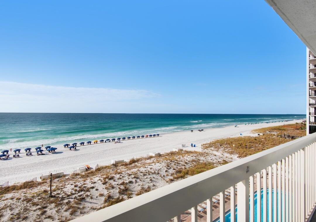 EXPERIENCE UNPARALLELED GULF-FRONT LUXURY FROM THE HEART OF DESTIN. Perfectly positioned along the sugar-white sands and emerald waters of the Gulf, this exquisitely appointed beachfront residence offers an extraordinary blend of sophistication, comfort, and investment potential.

Inside, a designer-inspired interior welcomes you with upscale finishes and elevated coastal elegance. The stunning gourmet kitchen is a true centerpiece, showcasing soft sage storybook cabinetry, gleaming stainless-steel appliances, a custom artisan backsplash, and endless countertops that provide both beauty and functionality. Every furnishing has been thoughtfully selected, creating a refined atmosphere that rivals the finest luxury resorts.

One of the most coveted floor plans at Pelican Beach Resort, this residence features the highly desirable hallway bunk alcove, allowing the condo to comfortably accommodate additional guests while maximizing rental appeal and revenue potential. The spacious primary suite serves as a private sanctuary, while two full bathrooms offer convenience and comfort for owners and guests alike.

Floor-to-ceiling Gulf views steal the show from the moment you enter. Step onto your private beachfront balcony and take in endless vistas of turquoise waters, powder-soft beaches, and breathtaking sunsets that paint the horizon each evening. Whether enjoying your morning coffee or an evening glass of wine, the scenery is nothing short of spectacular. Read more... Luxury continues throughout with premium flooring and absolutely NO CARPET, creating a seamless, sophisticated aesthetic that is both elegant and easy to maintain.

Pelican Beach Resort is one of Destin's most iconic beachfront destinations, offering an exceptional collection of resort-style amenities including multiple pools, an indoor/outdoor heated pool, beachfront sun decks, tennis courts, state-of-the-art fitness centers, a beachside tiki bar, café, grilling stations, arcade, and direct access to one of the most beautiful stretches of shoreline on the Emerald Coast.

Whether you're seeking a distinguished beachfront retreat, a luxury vacation home, or a premier income-producing asset, this remarkable Gulf-front residence offers a rare opportunity to own a piece of Destin's most coveted coastline.