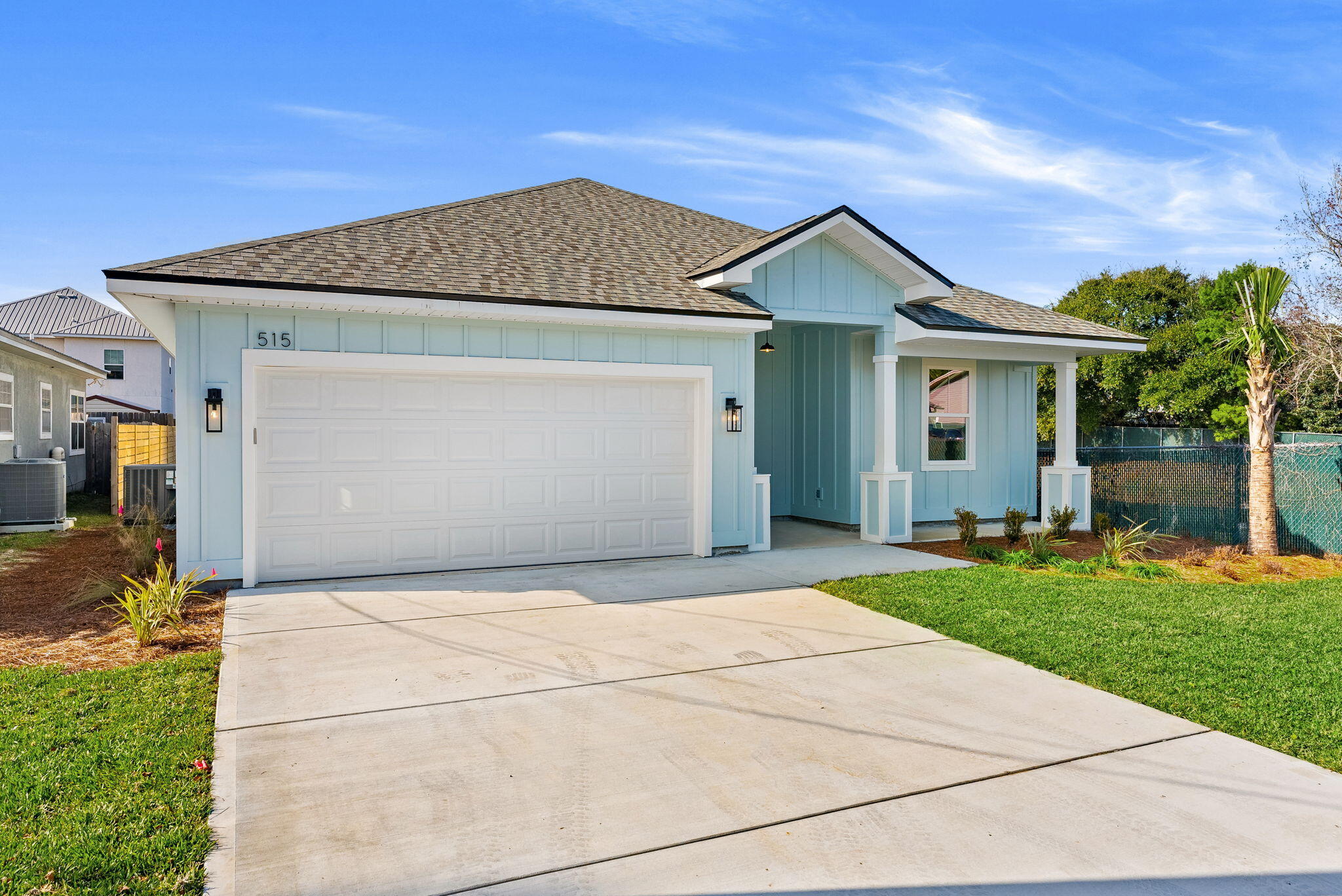 Just completed in 2025, 515 Pine Tree Drive offers 4 bedrooms, 2 bathrooms, and 1,750 sq ft of coastal style, perfect for full-time living, a beach getaway, or a short-term rental. Inside, enjoy 8' doors, wide-plank flooring, and recessed lighting throughout an open layout. The kitchen impresses with a quartz island, two-tone navy and white cabinetry, stainless appliances, and pendant lighting. Both bathrooms feature quartz countertops and a spa-style frameless glass shower. Outside, a covered patio and privacy-fenced backyard round out this move-in-ready, zero-maintenance new build minutes from everything Panama City Beach has to offer.