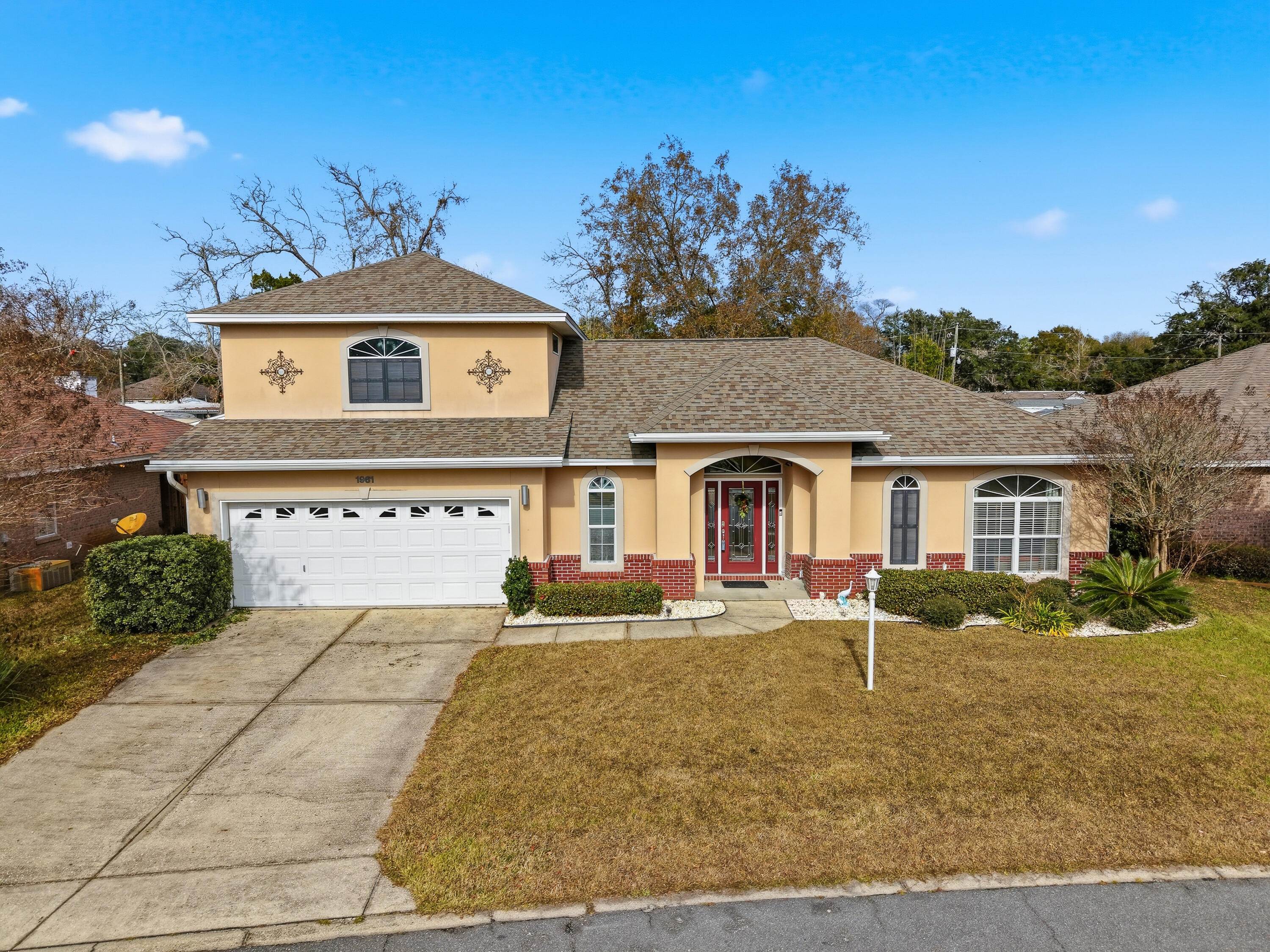 Beautiful pool home in sought-after North Ridge Creek, ideally located between Eglin AFB and Hurlburt Field. This move-in ready home features a newer roof (2021), HVAC systems (2023), and pool pump (2023). The open-concept floor plan offers engineered hardwood flooring, a chef's kitchen with black granite countertops, custom maple cabinetry, stainless appliances, breakfast bar, and spacious living area with Bluetooth surround sound throughout the first floor. The first-floor primary suite provides added convenience with direct laundry access. Enjoy Florida living in your private backyard oasis featuring a saltwater pool, composite decking, and low-maintenance artificial turf. Bonus room upstairs offers flexible space for a home office, gym, media room, or guest suite. Close to top-rated schools, shopping, dining, golf, hospitals, and military bases. A rare combination of location, updates, and lifestyle.