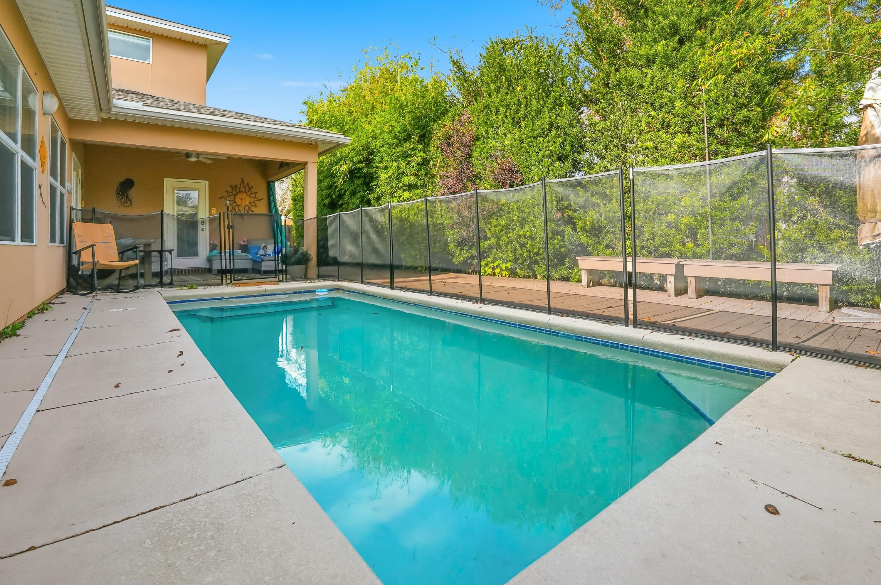 **Buyers may qualify for a $2,500 closing cost credit when using the preferred lender.** Welcome to the Florida lifestyle you've been searching for! Located in desirable North Ridge Creek between Eglin AFB and Hurlburt Field, this move-in ready pool home combines modern updates with low-maintenance living. Spend your weekends relaxing by the pool instead of tackling home projects, with artificial turf, composite decking, and major updates already completed, including a new roof (2021), HVAC systems (2023), & pool pump (2023). Inside, the open-concept floor plan is designed for everyday living & entertaining, featuring engineered hardwood floors, a chef's kitchen with black granite countertops, custom maple cabinetry, stainless steel appliances, a breakfast bar, & Bluetooth surround sound throughout the first floor. The spacious first-floor primary suite offers direct laundry access for added convenience. A second downstairs bedroom & full bath are tucked away in their own private hallway with a separate door, creating an ideal setup for a mother-in-law suite, guest retreat, teen suite, or private space for extended family. Upstairs, the large bonus room offers even more flexibility as a home office, gym, media room, or playroom. 
Underground utilities, a location on the hospital power grid, & close proximity to shopping, dining, golf, hospitals, top-rated schools, beaches, & both military bases make this home an exceptional choice for military families, professionals,  & anyone seeking a move-in ready home with resort-style outdoor living. This is more than a home--it's a lifestyle with less maintenance & more time to enjoy everything the Emerald Coast has to offer.