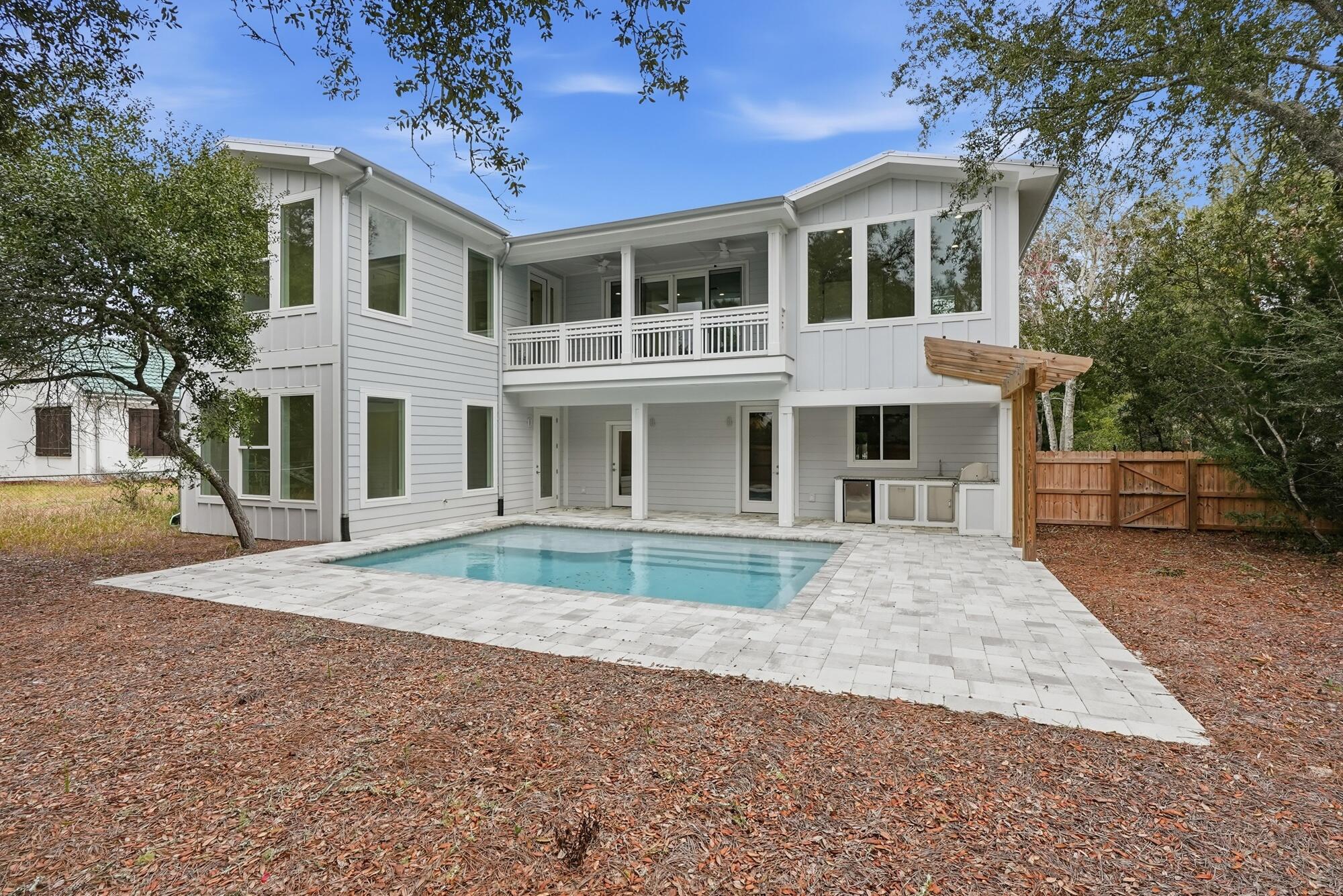 Welcome to your ultimate coastal escape--where modern elegance meets effortless beachside living. Completed in December 2024, this beautifully designed home offers 4 spacious bedrooms plus a charming bunk room, perfectly suited for hosting family and guests in comfort and style.

Step inside to an open-concept layout filled with natural light and elevated by luxury finishes throughout, including premium flooring, high-end fixtures, and a chef's kitchen outfitted with brand new appliances. Every detail has been thoughtfully curated to blend sophistication with functionality.

Outdoor living takes center stage on this impressive 1/3-acre lot. Enjoy your own private oasis featuring a large heated and cooled pool, perfect for year-round relaxation. Entertain with ease in the outdoor kitchen or unwind on the oversized screened-in porch designed for seamless indoor-outdoor living.

With deeded beach access, the sugar-white sands and emerald waters are just moments away--offering the ultimate coastal lifestyle without the restrictions of an HOA.

This is more than a home--it's a private retreat designed for luxury, comfort, and unforgettable coastal living.