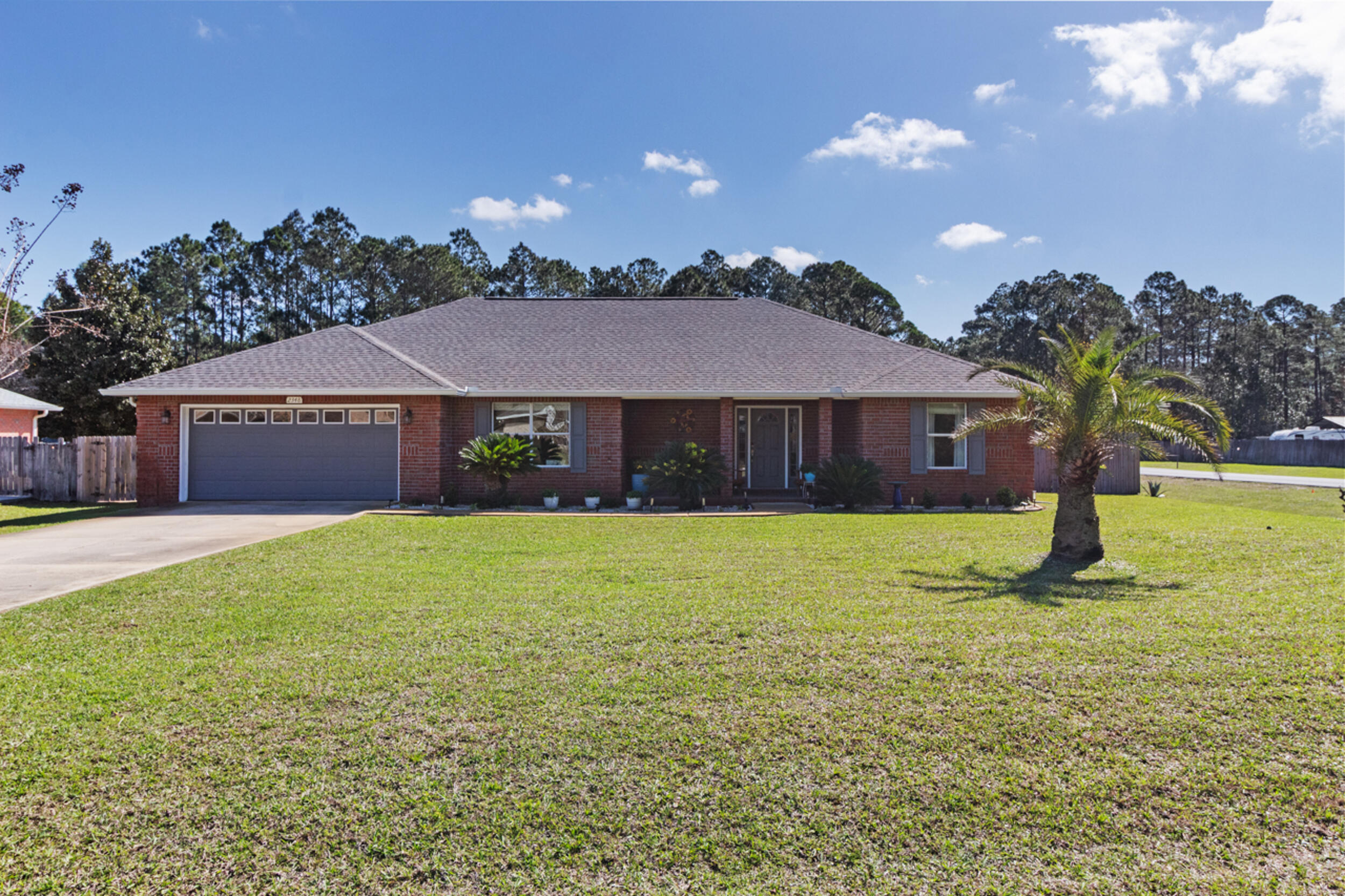 Corner lot in Holley by the Sea with major system updates already completed, including roof, HVAC, and hot water heater. This well-maintained home has been thoughtfully updated inside and out, making it truly move-in ready with no projects waiting for the next owner.

Welcome to 2348 Citrus Drive in Navarre, a beautifully cared-for home situated on a spacious corner lot in the highly desirable Holley by the Sea community. The property sits on an impressive 100 x 300 lot (approximately 0.69 acres), offering plenty of space, privacy, and flexibility. With numerous improvements already completed, this home offers comfort, peace of mind, and inviting curb appeal from the moment you arrive. Several major upgrades have already been completed, including a new roof, HVAC system, and hot water heater installed in 2023, giving buyers confidence that the big-ticket items are already taken care of.

The kitchen has been refreshed with new appliances, providing modern convenience for everyday living. Shower filters have also been added in the bathrooms for additional comfort.

Exterior improvements further enhance the home's efficiency and appearance. All window glass has been replaced with heat-reduction glass, improving energy performance while keeping the existing window frames. The property also features new gutters around the home, refreshed landscaping with river rock flower beds, and updated plantings that add to the home's clean and well-maintained look.

The outdoor space offers excellent functionality as well. The side gate provides an oversized entry, allowing room to bring in larger recreational vehicles such as boats or RVs, making it perfect for those who want to take full advantage of the coastal lifestyle. A storage shed with electricity is also located on the property, offering a great space for tools, hobbies, or additional storage.

Outdoor living is one of the highlights of this home. The large screened porch measures approximately 23 x 20, creating an ideal space for relaxing, entertaining, or enjoying Florida evenings without the bugs. The backyard decking and cement pads have been cleaned, painted, and sealed, while the garage walls have been freshly painted and the floor sealed. The home also includes a termite bond for added peace of mind.

Located in Holley by the Sea, residents enjoy access to one of Navarre's premier recreation centers featuring pools, fitness facilities, tennis courts, walking trails, and more.

With its large corner lot, extensive updates, oversized yard access for recreational vehicles, and true move-in ready condition, this home allows the next owner to simply unpack, settle in, and start enjoying the Navarre lifestyle from day one.