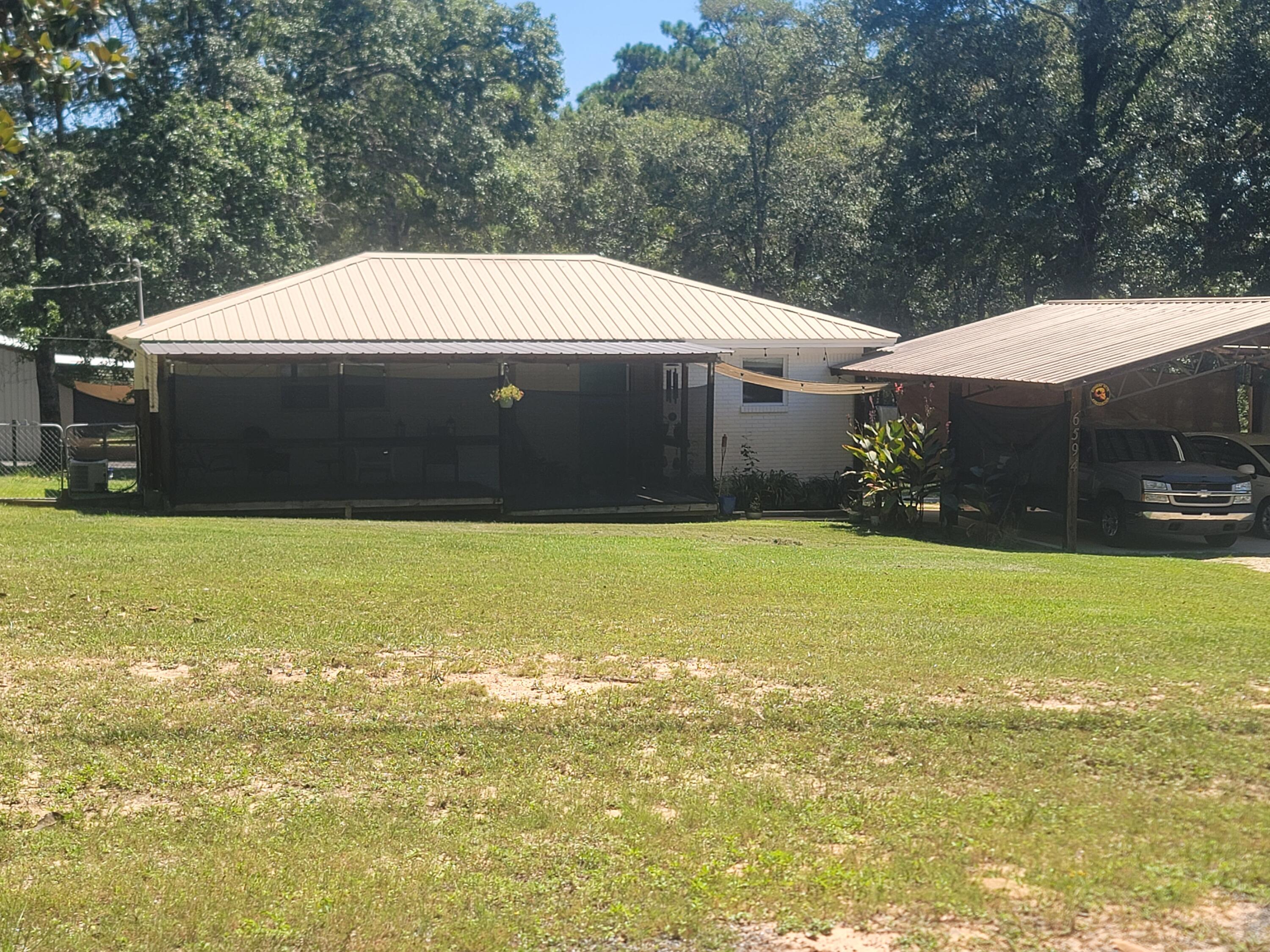 Homestead-Ready Brick Home on 5 Acres with Shop, RV Hookup & Pool

Discover the perfect homestead opportunity with this two-bedroom, one-bath brick home situated on five partially cleared acres in a quiet, peaceful neighborhood. Designed for privacy and self-sufficiency, this property offers the space and infrastructure ideal for gardening, small livestock, and sustainable living.

Enjoy morning coffee or evening sunsets from the covered front and back decks, while the
above-ground pool provides a refreshing retreat after a day spent outdoors.

A standout feature is the 30x30 totally insulated shed with a full bathroom and 2 a/c window units, perfect for a workshop, canning space, storage, or guest use. The property also includes an RV pad with full hookups and its own septic system, providing flexibility for extended stays or personal use.

Homestead highlights include:
"	Well water for independent water supply
"	Septic system
"	Brick construction for durability and low maintenance
"	Partially cleared and ready for gardens, orchards or animals
"	Quiet rural setting with room to grow

This property is ideal for those seeking a peaceful homestead lifestyle with room to expand and enjoy the outdoors.