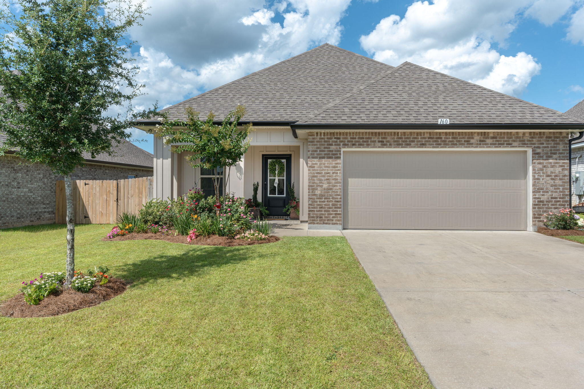 Welcome to 160 Hydrangea Boulevard in the desirable Bluffs at Lafayette subdivision--an exceptional opportunity to own a like-new DSLD Home Builders home without the wait for new construction. Built in 2024 and first occupied in March 2025, this beautifully maintained 3-bedroom, 2-bathroom home offers 1,642 square feet of thoughtfully designed living space. Best of all, there are currently no new homes of this floor plan available in the neighborhood, making this a rare opportunity.

The open-concept layout is perfect for both everyday living and entertaining, featuring a spacious kitchen with a large island, pantry, stainless steel appliances, and a gas range. Elegant finishes throughout the home include crown molding, recessed lighting, custom-framed mirrors, undermount sinks, and abundant natural light from energy-efficient Low-E vinyl windows.

The private primary suite is designed for comfort and relaxation, offering a large walk-in closet and a luxurious ensuite bath with a double vanity, garden tub, and separate shower. Two additional bedrooms and a full guest bath provide plenty of space for family, guests, or a home office.

Outside, you'll appreciate the covered front porch, rear covered patio, recently installed fencing, enhanced landscaping, architectural 30-year shingles, and exterior flood lighting--creating an inviting and functional outdoor space. Additional highlights include an energy-efficient tankless gas water heater and the added peace of mind of transferable DSLD builder warranties. Even better, DSLD is offering financing incentives on this resale home--an exclusive opportunity that is not available on any other resale home in the neighborhood.

Residents of Bluffs at Lafayette enjoy access to a community pool and a convenient location near Grady Brown Park, shopping, dining, and schools. Plus, you're just a short drive from the world-famous white-sand beaches and emerald waters of Scenic Highway 30A.

This is a rare chance to own a nearly new home with premium features, transferable builder warranties, exclusive financing incentives, and immediate availability. Schedule your private showing today!