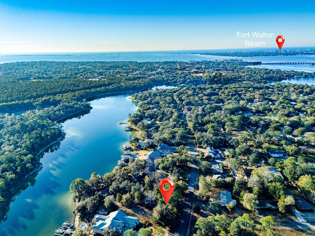 For the first time in over half a century, this coveted, multi-generational property in Poquito Bayou is available to the public. This is not just a lot; it is a sanctuary. Spanning a massive .8 acres with over 145 feet of waterfront, this parcel sits on a rare, protected bluff. This elevation offers peace of mind few waterfront owners possess: No flood insurance is required.

While the rest of the world rushes by, life here moves at the pace of the tide. The deep waters of the bayou are legendary for their calm, protected nature—even during rough weather. You can kayak or paddleboard nearly 365 days a year, paddling out to watch dolphins corral fish for breakfast or spotting a manatee gliding through the glass-like surface.

Your view? A pristine natural forest across the water—no neighbors looking back at you. Just you, the jumping mullet, and the bald eagles and ospreys hunting at sunrise. This is the rarest of opportunities to secure a high-and-dry, deep-water estate that has been held tight by one family for five decades. Don't let another decade slip by dreaming about it.
