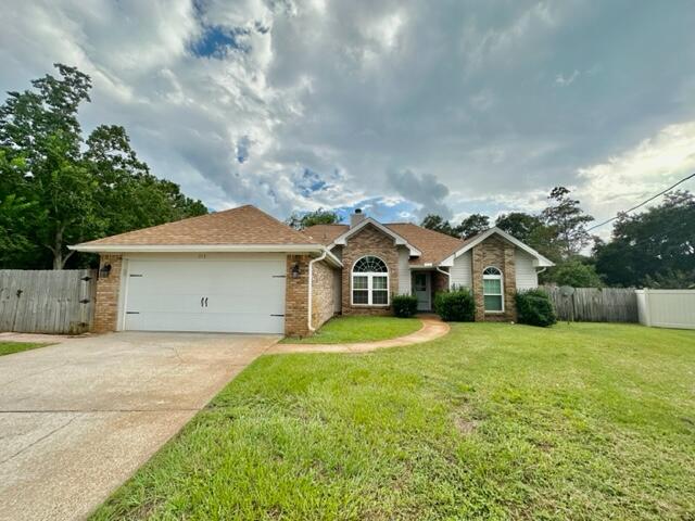 AVAIL: 8/26. S/D = $2,250, can be broken up in 2 monthly installments, if qualified. Dogs allowed upon Owner's approval & w/ a pet fee. Welcome to this beautiful single story home located in the desirable Timberlake Estates, very convenient to Hurlburt AFB. This house boasts an array of modern features that are sure to impress. The kitchen is equipped w/ sleek stainless steel appliances & tiled countertops, perfect for preparing delicious meals. Cozy up in front of the fireplace in the elegant living room, which features cathedral ceilings that add a touch of spaciousness. The split bedroom plan ensures extra privacy for all. The inside utility room provides added convenience for laundry tasks. With a 2-car garage, you'll have plenty of space for parking & storage. The house showcases stylish tile flooring throughout, offering durability & easy maintenance. Step outside onto the open deck or open back patio & enjoy the Florida sunshine. The mostly brick siding adds charm & character to the exterior, while the privacy fenced backyard provides a serene & secluded space for outdoor activities. This home is perfect for those seeking a comfortable & modern living experience. Don't miss out on the opportunity to make this house your home. Contact us today to schedule a tour & see all the wonderful features this property has to offer!
