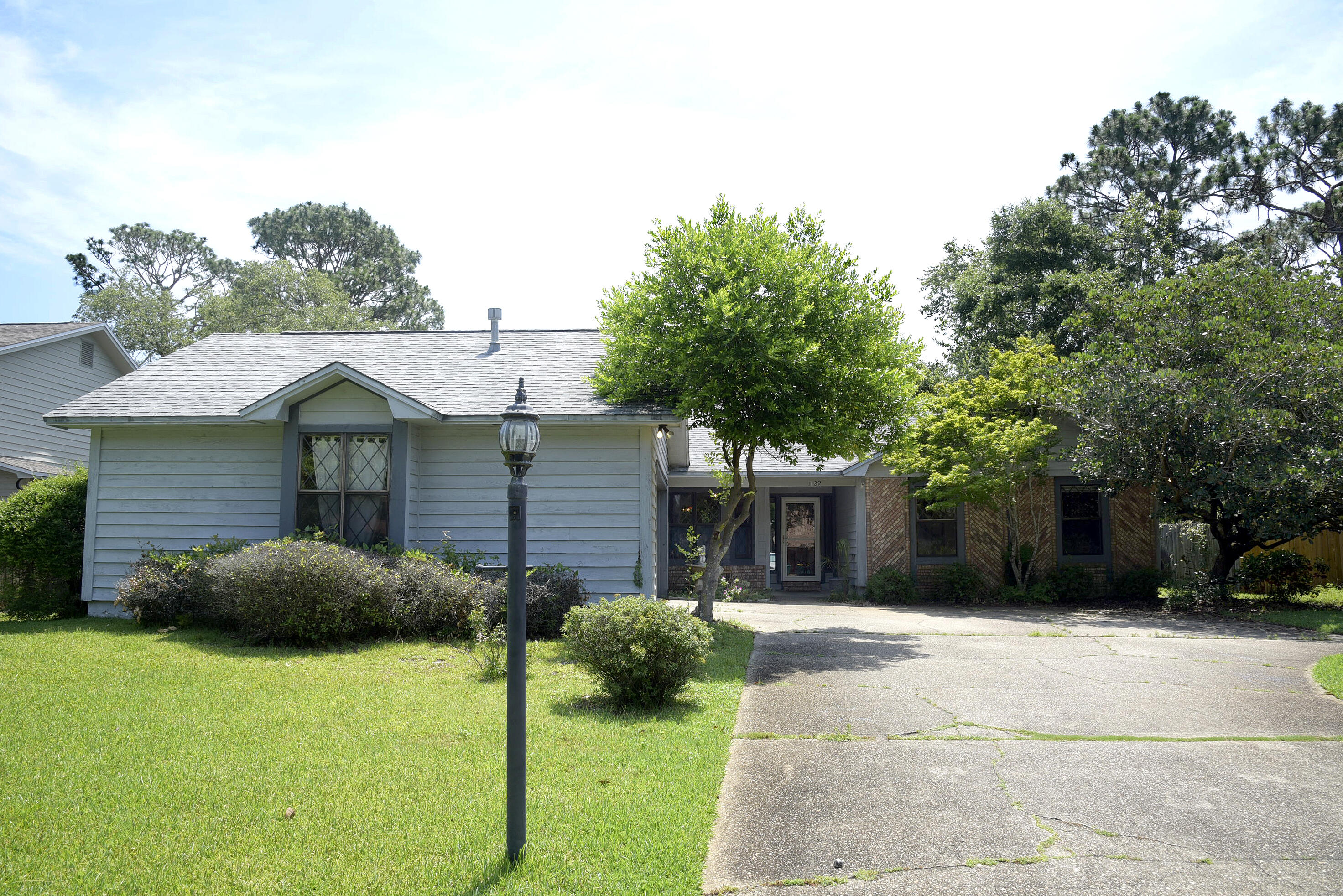 Welcome home to Bluewater Bay! This charming three-bedroom property features a fully fenced backyard, offering both privacy and peace of mind. Inside, the kitchen shines with granite countertops and a gas stove--perfect for everyday cooking with a touch of style. The primary bathroom includes a spacious walk-in shower, creating a comfortable, spa-like retreat. A heated and cooled Florida room extends your living space and opens directly onto the backyard deck, ideal for relaxing or entertaining. Schedule your showing today and see all this home has to offer!