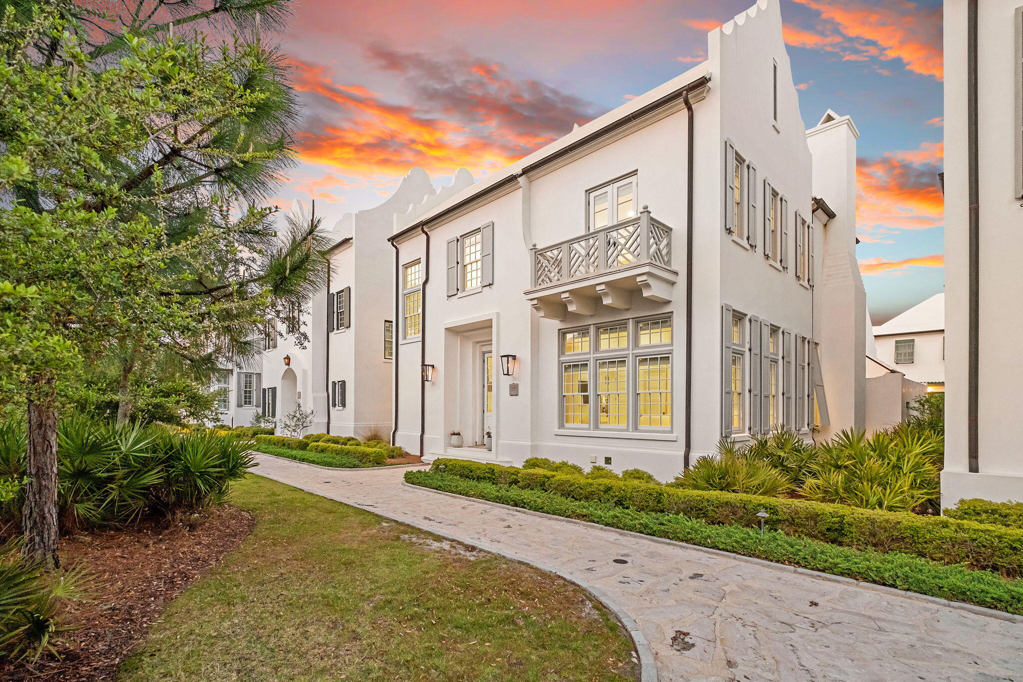 On a quiet pedestrian alley within Alys Beach, 91 Whalebone Alley reads more like a study in coastal architecture than a traditional beach house. Built in 2020, the residence embraces the community's defining language; clean geometry, white masonry, and a deliberate restraint that allows light and proportion to do the work. Spanning 3,526 square feet across two levels, the home feels composed and intentional, designed for both privacy and effortless gathering. The structure itself is grounded in permanence. Concrete block construction, smooth stucco finishes, and a solid roofline create a sense of weight uncommon for coastal homes. Inside, four bedrooms and six baths are arranged with a focus on flow rather than excess. The living spaces open naturally toward the private courtyard pool, where indoor and outdoor living blur in the way Alys Beach does best; quiet mornings, shaded afternoons, and evenings shaped by soft coastal air.

The interiors lean minimal without feeling stark. Light moves freely through the home, softening the architecture and emphasizing proportion over ornamentation. The kitchen anchors the main living space with a full suite of appliances and clean-lined finishes, while each bedroom is positioned to offer separation for guests. Multiple baths add flexibility, reinforcing the home's livability whether used as a private retreat or shared with family and friends.

Life at 91 Whalebone Alley extends beyond the walls. Deeded beach access places the Gulf within easy reach, while Alys Beach's curated amenities; pools, tennis courts, fitness facilities, and landscaped pedestrian paths; create a walkable environment designed as carefully as the homes themselves.

The result is a residence that feels aligned with its surroundings; architectural, understated, and quietly confident. In a community known for design discipline, 91 Whalebone Alley stands as a refined expression of the Alys Beach aesthetic.