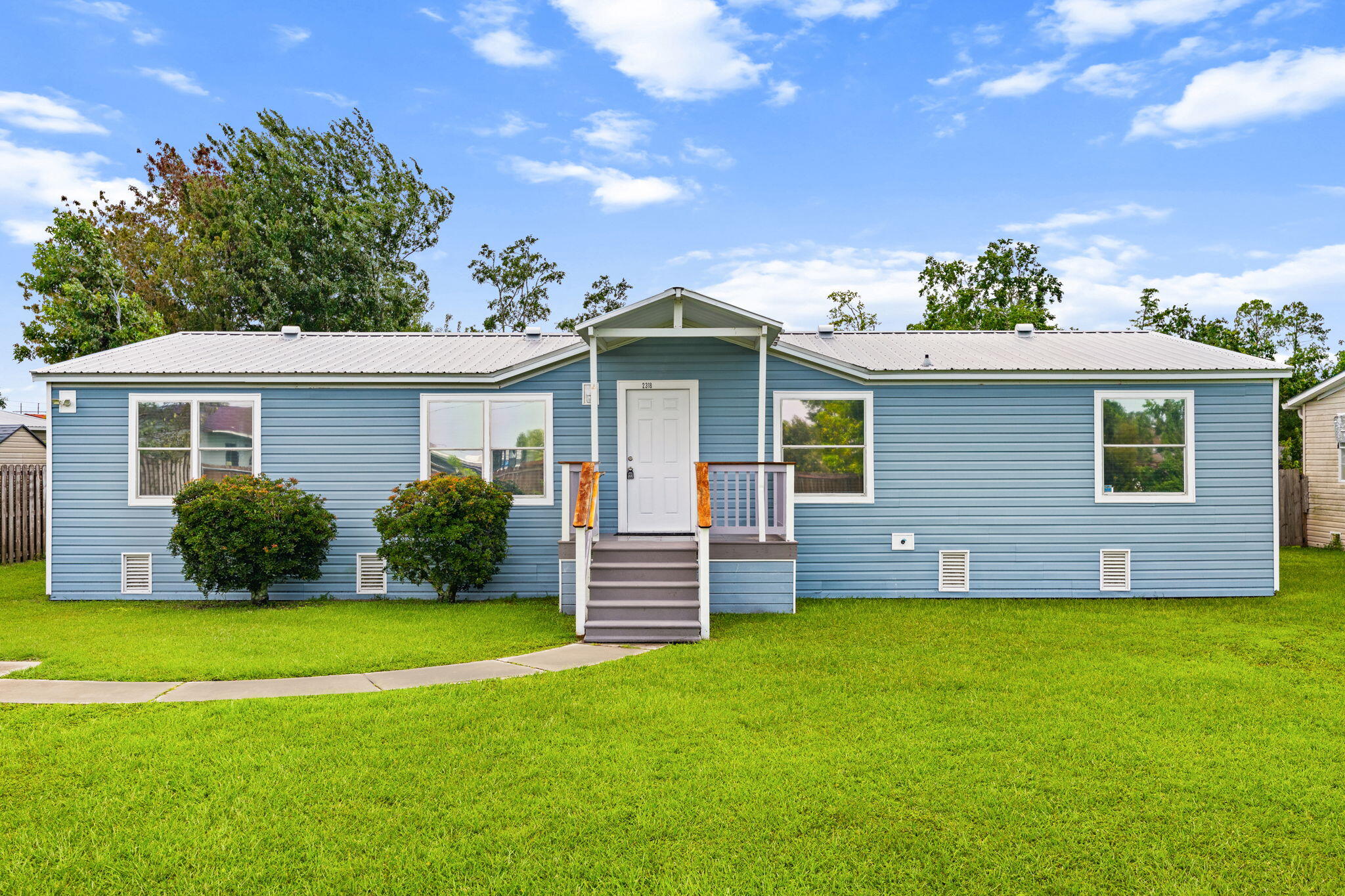 Completely renovated and move-in ready! This beautifully updated 3-bedroom, 2-bath manufactured home offers 1,792 heated and cooled sq. ft. on a 0.24-acre lot in Panama City. No one has lived in the home since the renovation, giving the new owner the opportunity to enjoy a like-new interior. Major updates include a new roof, 2024 HVAC, new water heater, all-new electrical, all-new plumbing, new blinds, and luxury vinyl plank flooring throughout. For added durability, the flooring was installed over two layers of wood subflooring. The home features two separate living areas, including a spacious family room and a second living area with a fireplace that opens to the dining area and updated kitchen with stainless steel appliances. The primary suite includes a walk-in closet with a reinforced hurricane safe room/shelter, plus a beautifully renovated en-suite bath with a double vanity and walk-in shower. Enjoy the large backyard with a detached storage building and attached covered area, perfect for storage, a workshop, or outdoor entertaining. Conveniently located near shopping, dining, schools, Tyndall Air Force Base, and the beautiful Gulf Coast beaches. Schedule your private showing today!
 Completely renovated and move-in ready! This beautifully renovated manufactured home offers 3 bedrooms, 2 bathrooms, and 1,792 heated and cooled square feet on a 0.24-acre lot in Panama City. No one has lived in the home since the renovation, giving the new owner the opportunity to enjoy a like-new interior. Major updates include a new roof, new 2024 HVAC system, new water heater, all-new electrical, and all-new plumbing. The flooring was installed over two layers of wood subflooring for added strength and durability, then finished with high-quality flooring throughout. The kitchen and bathrooms have been beautifully updated with modern finishes. The spacious primary suite features a walk-in closet that has been reinforced to serve as a hurricane safe room/shelter. The windows are in good condition and operate properly. Conveniently located near shopping, dining, schools, Tyndall Air Force Base, and the beautiful Gulf Coast beaches. If you're looking for a fully renovated manufactured home with major system upgrades already completed, this is one you won't want to miss!