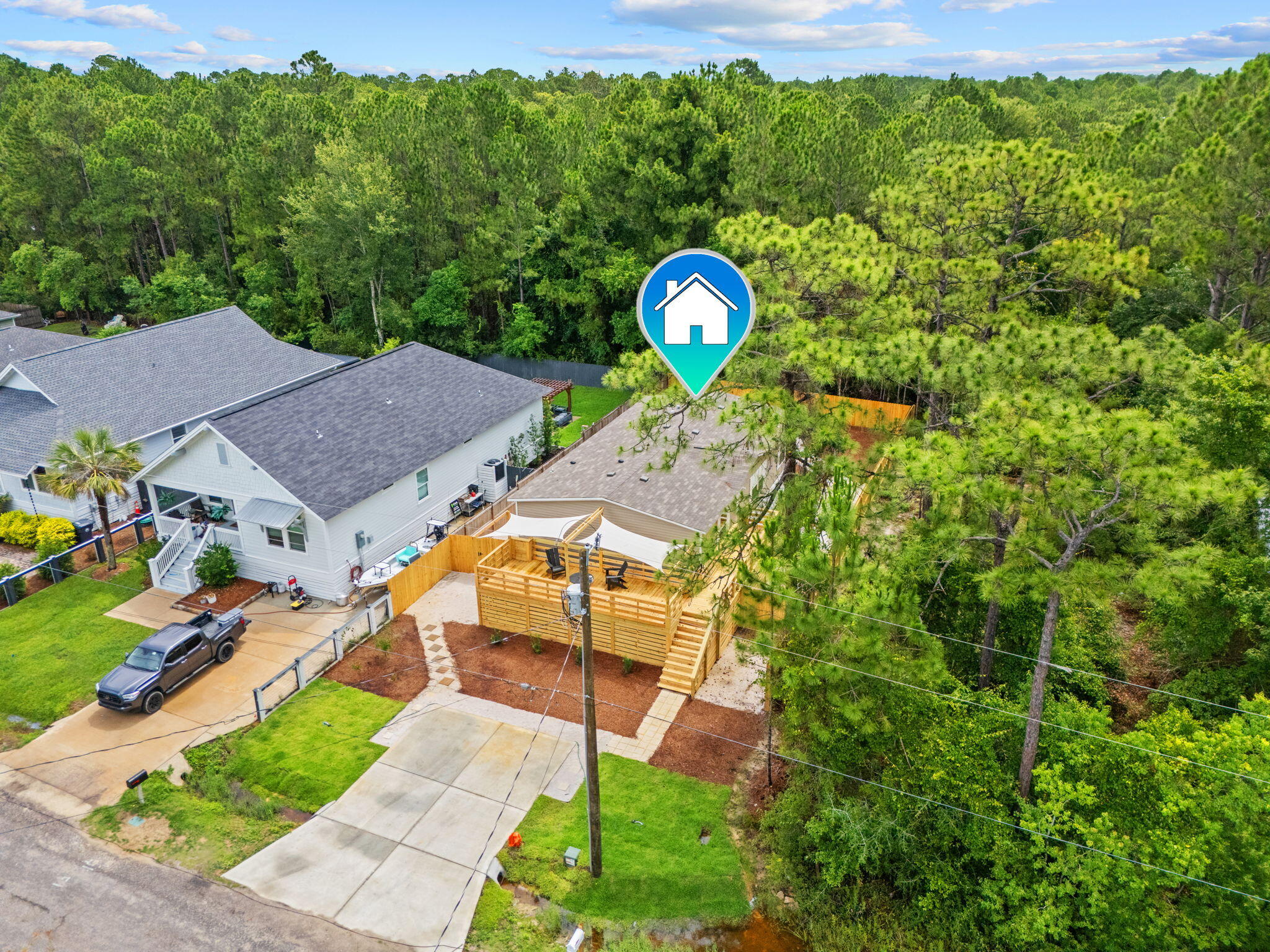 Welcome to 107 N 6th Street, a move-in-ready 3-bedroom, 2-bath manufactured home ideally located less than a mile from Cessna Landing Boat Launch on Hogtown Bayou and just 4 miles from the Emerald Coast's sugar-white beaches. Perfect as a full-time residence, weekend fish camp, vacation getaway, or investment property, this home offers no HOA, a privacy-fenced yard, and plenty of space for your boat, trailers, and fishing gear. Thoughtful upgrades throughout and easy access to boating, fishing, and coastal living make this a versatile opportunity in a prime location. Welcome to 107 N 6th Street, a newly installed, move-in-ready manufactured home ideally located just 4 miles from the Emerald Coast's sugar-white beaches and less than a mile from Cessna Landing Boat Launch on Hogtown Bayou. With no HOA and thoughtful upgrades throughout, this property offers flexibility for full-time living, a vacation retreat, fish camp, or an income-producing investment.

Set on a freshly landscaped, low-maintenance lot, the home features a spacious 400-square-foot deck--perfect for outdoor dining, relaxing with morning coffee, or hosting friends. A new privacy fence encloses the backyard, creating a quiet, secure space to unwind, garden, or enjoy time outdoors.

Inside, the popular Satisfaction floor plan delivers 1,264 square feet of bright, open living space with 3 bedrooms and 2 bathrooms. The main living area is filled with natural light from ENERGY STAR® rated windows that provide excellent insulation without sacrificing brightness. The open kitchen flows seamlessly into the dining and living areas and comes equipped with brand-new appliances, ample cabinetry, and a functional layout designed for everyday comfort and easy entertaining.

The primary suite is privately located and includes an ensuite bathroom and walk-in closet, offering a peaceful retreat at the end of the day. Two additional bedrooms provide flexibility for guests, a home office, or family needs.

Built to meet ENERGY STAR® eBuilt" standards, this home stands out for its energy-efficient construction and modern systems, including high-performance windows and doors, a smart thermostat, and cost-saving mechanical systems designed to reduce utility expenses while maintaining year-round comfort.

From boating and beaches to dining and shopping just minutes away, this location delivers both lifestyle and convenience. Whether you're enjoying evenings on the deck, launching a paddleboard nearby, or appreciating the ease of a brand-new, energy-efficient home, 107 N 6th Street offers modern coastal living without restrictions.