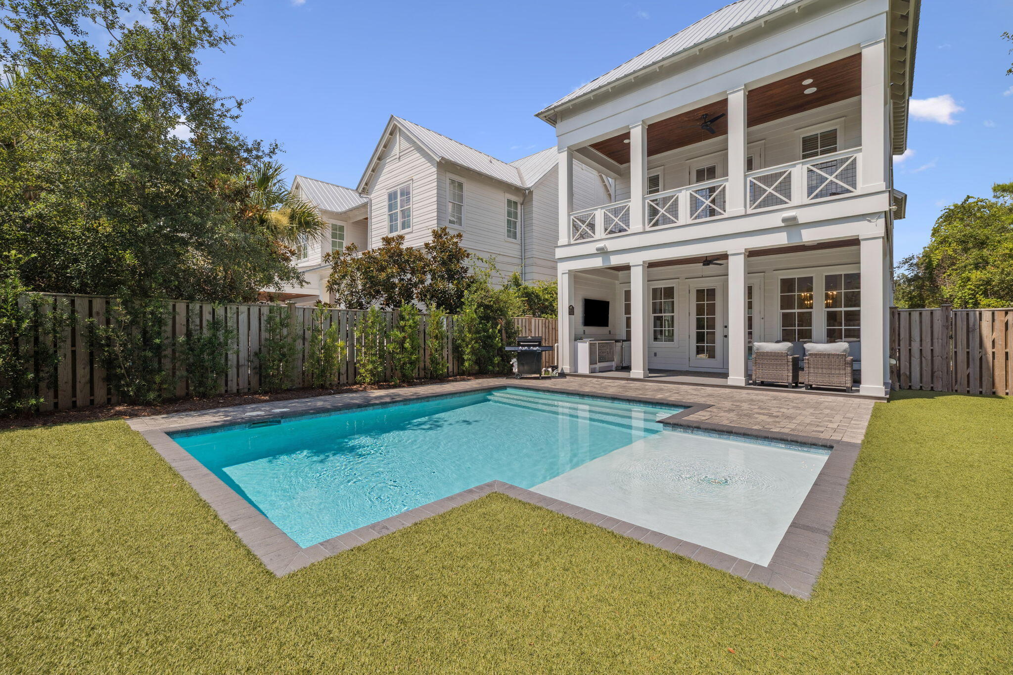 INVESTORS: Rentals booked through August! Take advantage of your investment already set with bookings to transfer.
Luxury meets coastal charm in this fully furnished, turnkey retreat south of Scenic Highway 30A, offering five en suite bedrooms plus a bunk room, private pool, and easy beach access just steps away. Designed to sleep up to 16, this home delivers the ideal blend of lifestyle, comfort, and rental-ready flexibility. 
Set on a corner lot in a highly desirable South of 30A location with no HOA, the residence showcases Southern coastal architecture elevated by modern finishes throughout. Expansive full-width front and rear porches, along with a covered poolside terrace and outdoor bar, create exceptional indoor-outdoor living, perfect for entertaining and year-round enjoyment. Inside, soaring ceilings, hardwood flooring, and sun-filled living spaces welcome you into an open, inviting floor plan. The gourmet kitchen features quartz countertops, premium stainless steel appliances, and generous prep space suited for everything from casual beach days to hosting larger gatherings. A first-floor guest suite, multiple balconies, and a garage add convenience and flexibility rarely found at this level.
Tucked away from heavier foot traffic, the home enjoys access to a quiet neighborhood beach boardwalk just down Sand Dunes Road, offering a peaceful path to the sugar-white sands and emerald waters that define 30A. Conveyed fully furnished, including a golf cart, this property is truly rental-ready and well-positioned for personal enjoyment or short-term rental use.
A rare opportunity to own a south-of-30A coastal home with private pool, strong rental appeal, and immediate beach access--all just moments from the dining, shopping, and charm that make 30A one of the most sought-after coastal destinations in the country.