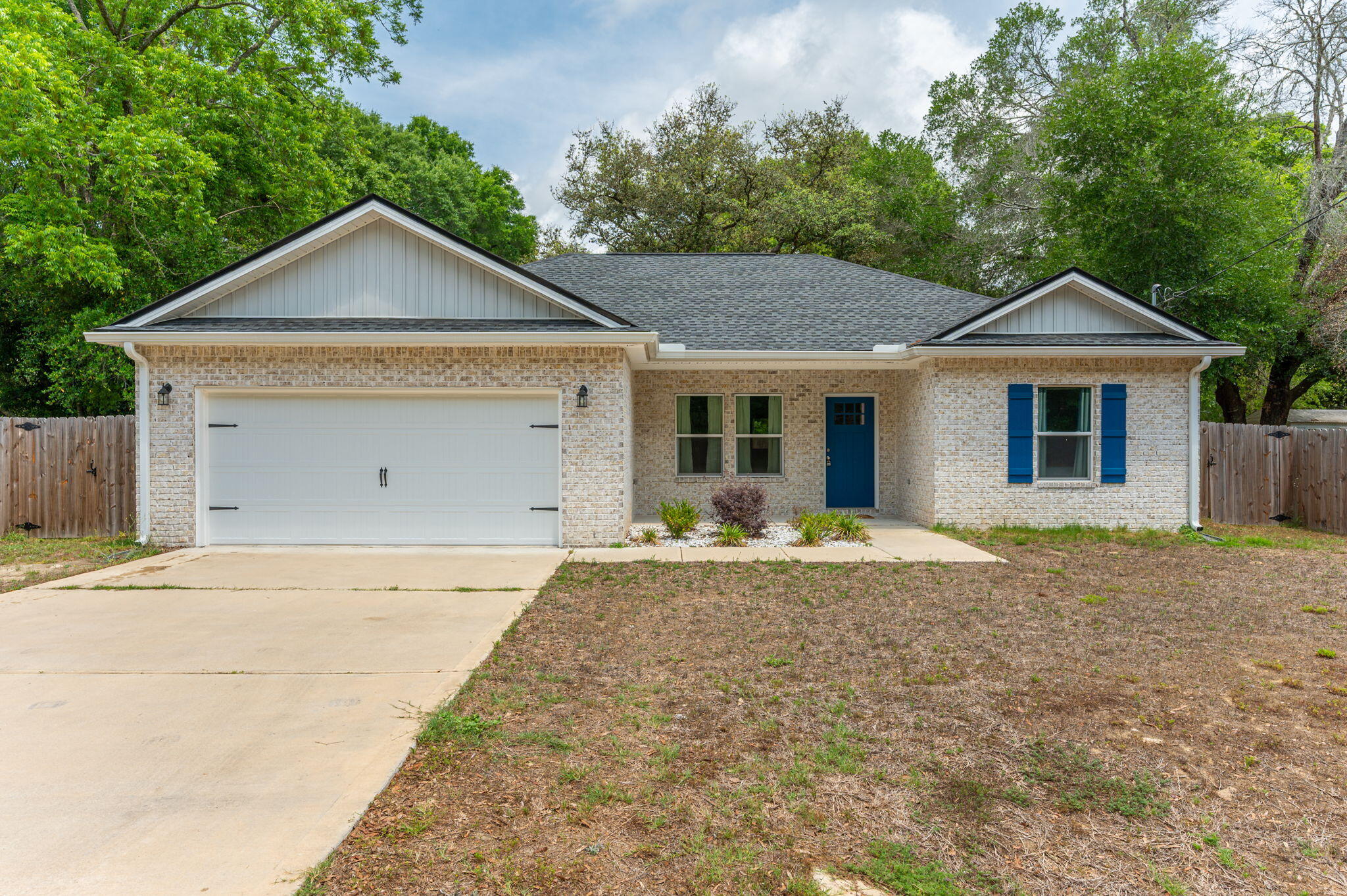 Welcome to your dreamy retreat in Midtown Crestview, where modern comfort meets spacious, stylish living. Built just 2 years ago, this beautifully maintained all-brick 3-bedroom, 2-bath home sits on a .86-acre lot, offering privacy and plenty of room to spread out. From the moment you arrive, you'll be charmed by the cozy front porch, perfect for welcoming guests or enjoying a quiet moment outdoors. Out back, the breathtaking oversized enclosed porch creates an incredible space for year-round enjoyment, complemented by an additional covered porch ideal for entertaining. A full privacy fence surrounds the property, giving you a true sense of seclusion and space. Inside, the home features a thoughtfully designed layout with ceiling fans throughout, a spacious interior laundry room, and an open, inviting living area. The kitchen is a standout, showcasing white shaker cabinets, sleek quartz countertops, a large center island, stainless steel appliances, and a convenient pantry--perfect for both everyday living and hosting.
The primary suite is generously sized and offers a true retreat feel, complete with a private en-suite bathroom featuring dual vanities and an impressively large primary closet.
Located in the county for lower taxes, yet just minutes from everything you need--only 3 miles to downtown Crestview and nearby shopping plazas. Commuters will appreciate the convenient access, with Eglin AFB less than 25 miles away and Duke Field under 12 miles. Plus, Shoal River Middle School and Riverside Elementary are just about a mile from your doorstep.
This home blends modern upgrades, functional space, and a prime location--don't miss your opportunity to make it yours.