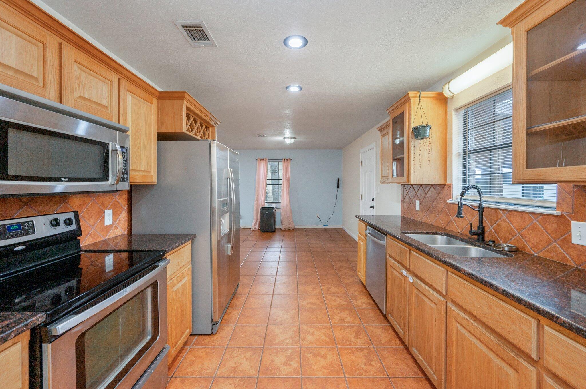 Welcome to your next home in highly sought-after Gulf Breeze, perfectly designed for comfort, convenience, and style. This pet-friendly rental (with owner approval) offers durable hard flooring throughout, making it ideal for both aesthetics and easy maintenance. The kitchen boasts stainless steel appliances, perfect for cooking enthusiasts.  

Enjoy cozy evenings by the wood-burning fireplace or movie nights with the custom-built drop-down projector screen and surround sound stereo system in the living room. Step outside to a covered back patio and a spacious backyard with a storage shed, offering ample space for outdoor enjoyment.  

Located in the top-rated Gulf Breeze