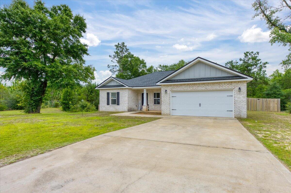 Welcome to this newer 3-bedroom, 2-bath home nestled at the end of a quiet cul-de-sac in North Crestview's Majestic Oaks Vineyards community. Situated on a half-acre lot with no neighbors on one side and generous space between each home, this is the kind of street where kids ride bikes after school and you actually know your neighbors privacy and community all at once. Fenced in back yard. Not all of the .5 acres is fenced. The all brick exterior opens into a spacious open concept floor plan with 10ft ceilings in the main living area, Luxury Vinyl Plank flooring throughout the common spaces, and carpet in the bedrooms. The kitchen is built to impress quartz countertops, white shaker cabinets, stainless steel appliances, a work island with bar seating, and a corner pantry, all flowing seamlessly into the dining and living areas. The owner's suite features double vanities, and a walk-in closet. A large laundry room and double-pane windows add everyday functionality, and a charming front porch gives you the perfect spot to enjoy a quiet morning coffee.  Conveniently located north of I-10 with easy access to Okaloosa County schools.