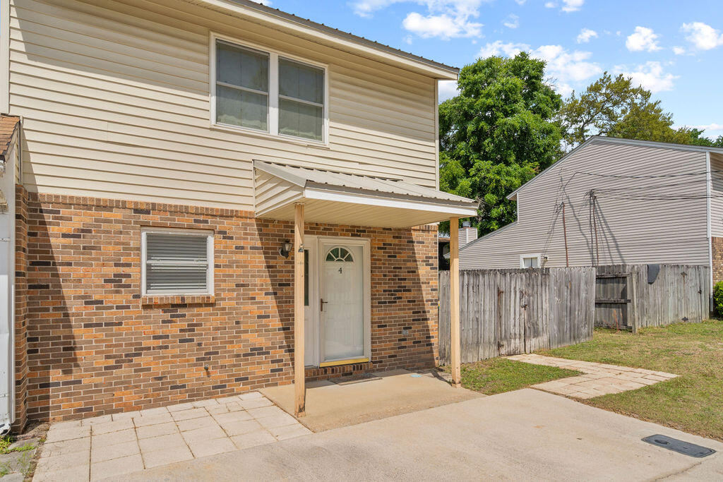 MOTIVATED SELLER!!!   $15k price reduction!! Welcome to this lovingly maintained 2-bedroom, 1.5-bath townhouse offering 1,320 square feet of comfortable, well-proportioned living space in one of Fort Walton Beach's most convenient locations -- tucked right between Eglin Air Force Base and Hurlburt Field. Whether you're active duty, a veteran, a DoD civilian, or simply someone who values an easy commute and a great community, this home is worth a serious look.
Inside, the main level flows from a welcoming living area into a functional kitchen, laundry room and a convenient half bath rounding out the first floor. Upstairs, two well-sized bedrooms share a full bath -- a layout that works beautifully whether you're settling in solo, sharing with a roommate, or setting up a guest room.
The big-ticket items are already handled. A durable metal roof (approx. 10 years old) offers lasting storm protection and long-term peace of mind -- a real asset on the Florida Panhandle. The HVAC system and water heater were both replaced in 2022,  keeping things cool and efficient through those warm Gulf Coast summers without skipping a beat. This home has clearly been cared for.
**The fireplace is decorative only.  Chimney was removed during metal roof install.

Step out back to a fully fenced yard -- private, low-maintenance, and ready for pets, entertaining, or just enjoying the Florida outdoors at your own pace.

And here's the bonus: no HOA! Just your home, your way. Add in easy access to base amenities for military and their families, the sugar-white beaches of the Emerald Coast, top-rated dining, and everyday shopping -- and you've got a location that's hard to beat. Schedule your showing today!