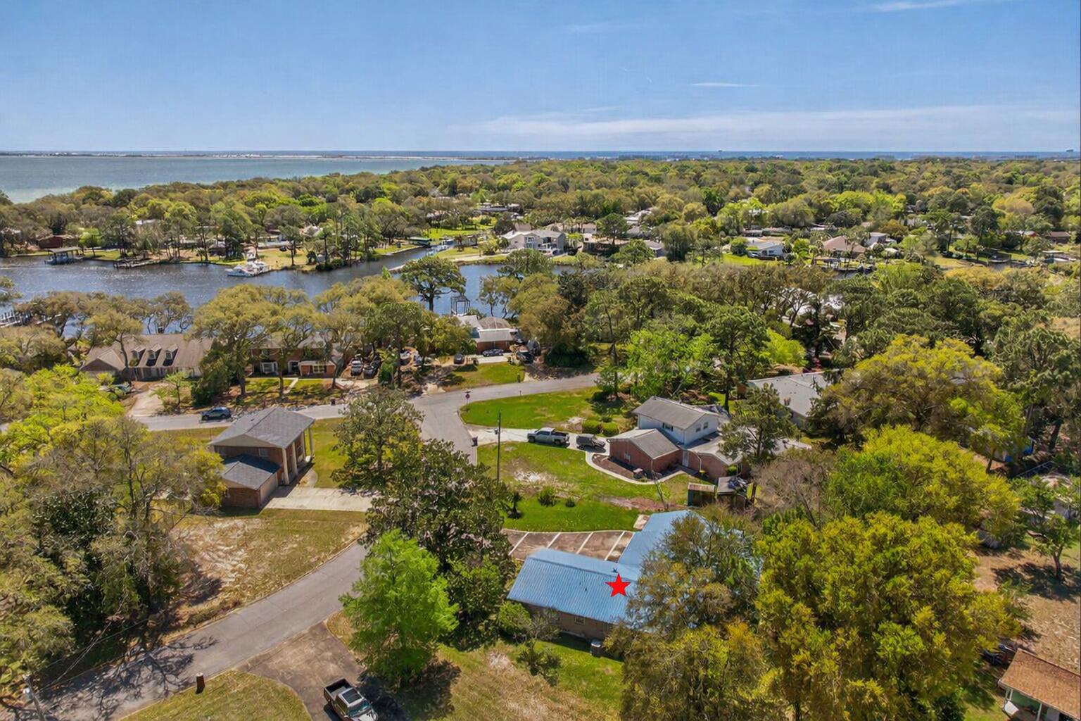 RENT--REMODEL--FLIP!  Investment potential with options! This vintage, 4BR/2BA gem is located in the heart of Elliott Point, just minutes from Fort Walton Yacht Club, Cinco Bayou, downtown Fort Walton Beach, Ferry Park, shopping, restaurants, white, sugary, sand beaches & tourist hotspots! This property has been in the same family for almost 30 years! Highlights include a light kitchen remodel, metal roof, sprawling 0.34A lot, deep one-car garage, screened porch, outdoor workshop, beautiful parquet flooring, vintage bathroom tile, fenced backyard and spacious square footage. Large den area features a gas fireplace with access to the screened porch!  Sunny bay window overlooks the backyard!