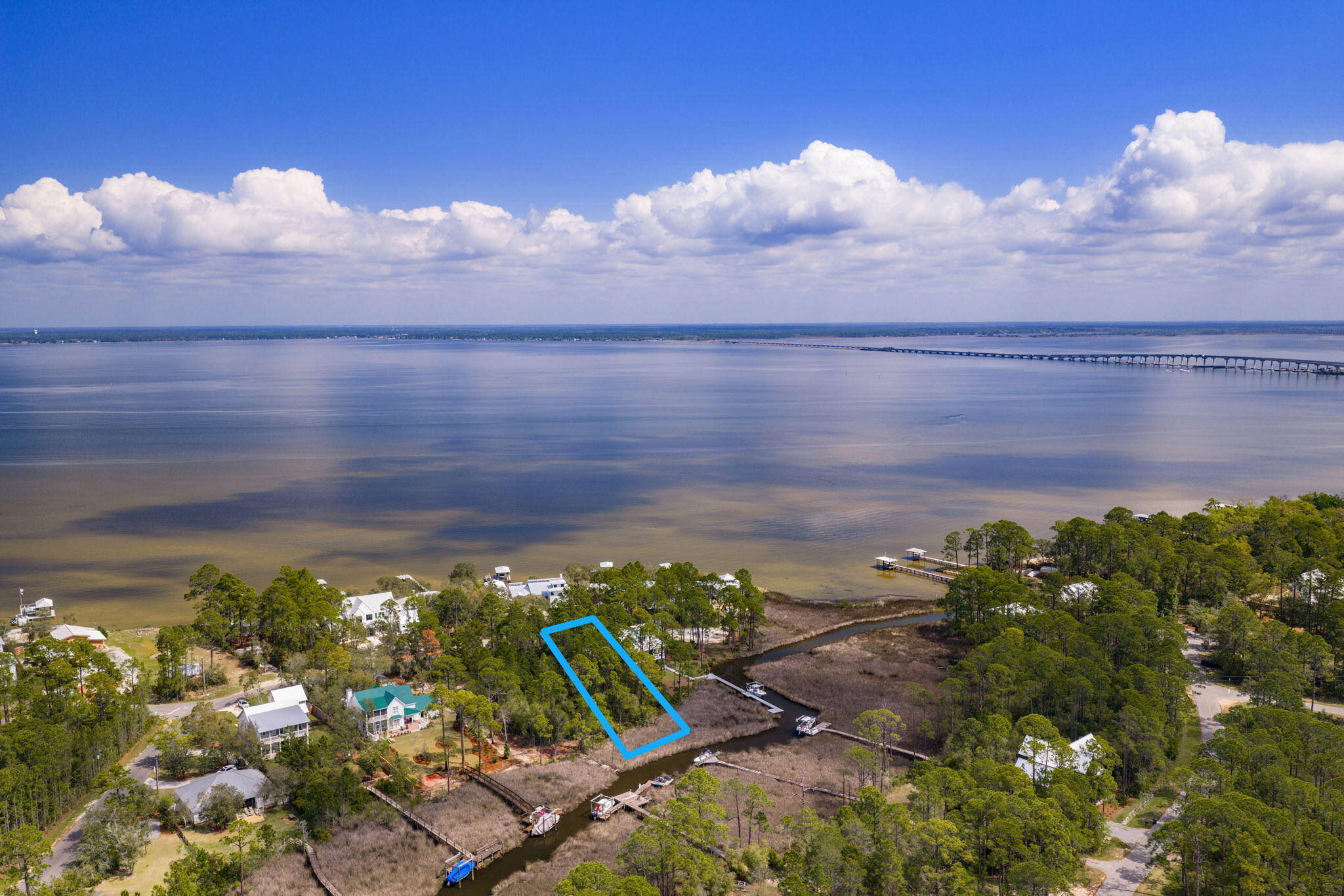 Build your life around the water--where every day feels like a getaway & every sunset is yours to keep. This rare .67-acre canal-front homesite offers direct access to Choctawhatchee Bay, inviting you to fully embrace the waterfront lifestyle. Design your dream home w/room for a dock & boat, and set out at a moment's notice--whether it's a sunset cruise to The Bay for dinner, a fun-filled Saturday at Crab Island, or a peaceful morning paddle boarding right from your backyard. Kayak the calm canal waters, cast a line at golden hour, or simply unwind and soak in the quiet beauty that surrounds you. Install your dock & bring your boat now--start enjoying the waterfront lifestyle immediately while you design and build your dream home.  With no build-out timeframe, you have the freedom to create exactly what you envision, all while already living the lifestyle most are waiting for.  The generous lot size offers endless design possibilities, including the potential for bay views depending on your vision. Tucked within a charming coastal neighborhood that feels worlds away, yet conveniently close to the beach, dining, shopping, and everything the Emerald Coast has to offer--this is an affordable opportunity to secure your place on the water and start living the lifestyle most only dream about.