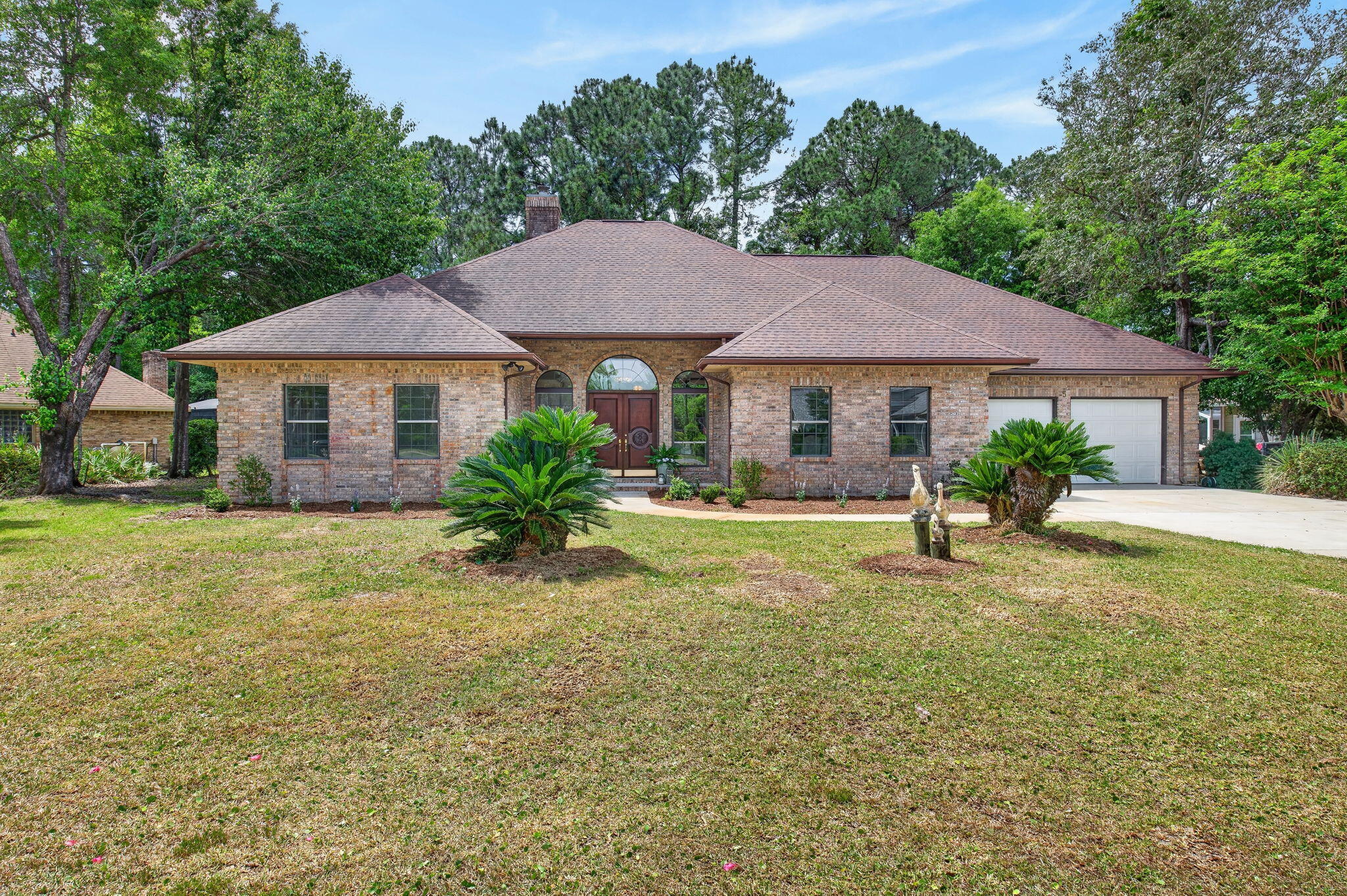 Turnkey Perfection in Gated Bluewater Bay - Golf Course Living

Fully renovated, all brick, and completely move in ready, this 5-bedroom, 3-bath Southwind gem sits behind the gates of one of the Emerald Coast's most sought-after communities, backing directly onto the golf course for peaceful, scenic views. The Primary Suite:
Spacious, serene, and designed to unwind, this oversized retreat opens directly to a sun drenched 300+ sq ft Florida room. Enjoy a spa-like bath with garden tub, tiled shower, dual sink vanity, and a custom walk-in closet with built in wood shelving.

The Kitchen:
Built for both everyday living and entertaining, featuring quartz countertops, a large center island, gas range, and separate oven. A formal dining room and bright eat-in area offer flexibility, while the adjacent laundry room adds a second fridge, utility sink, and extra workspace.

The Flex Space:
A private 400 sq ft upstairs suite with its own bath and walk-in closet - perfect for guests, in-laws, or a quiet retreat.

Elevated Finishes Throughout:
Wide-plank, commercial grade LVP flooring pairs beautifully with quartz surfaces and warm gold hardware, creating a cohesive, high-end feel across the home.

The Community:
Located within gated Southwind at Bluewater Bay, residents enjoy access to an 18-hole golf course, tennis and pickleball courts, a 120-slip marina, pools, and miles of scenic trails.