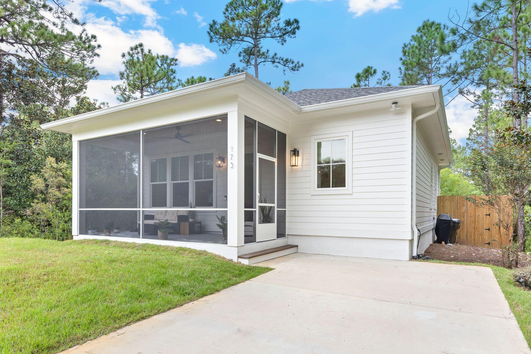 Property appraised at $410K! Exceptional value opportunity! Tucked away on an end of street location in Santa Rosa Beach, this coastal-inspired home blends privacy, comfort, and style. With 1,050 square feet of thoughtfully designed living space, the open layout, vaulted ceiling, and sunlight streaming through windows and glass doors create a welcoming feel. The home offers two spacious bedrooms and two full bathrooms, with the primary bedroom featuring an ensuite bath, providing comfort and convenience for both residents and guests. A screened porch and fenced backyard invite you to enjoy the Florida lifestyle, whether relaxing with a morning coffee, entertaining friends, or creating a private outdoor retreat. Flooring, cabinetry, tile selections and custom trim work reflect the high-end design of the 30a area. With its refined finishes, serene setting, and versatile design, this property is not only an inviting primary residence but also a smart investment opportunity. Ideal for long-term rental income the home captures the essence of coastal living.