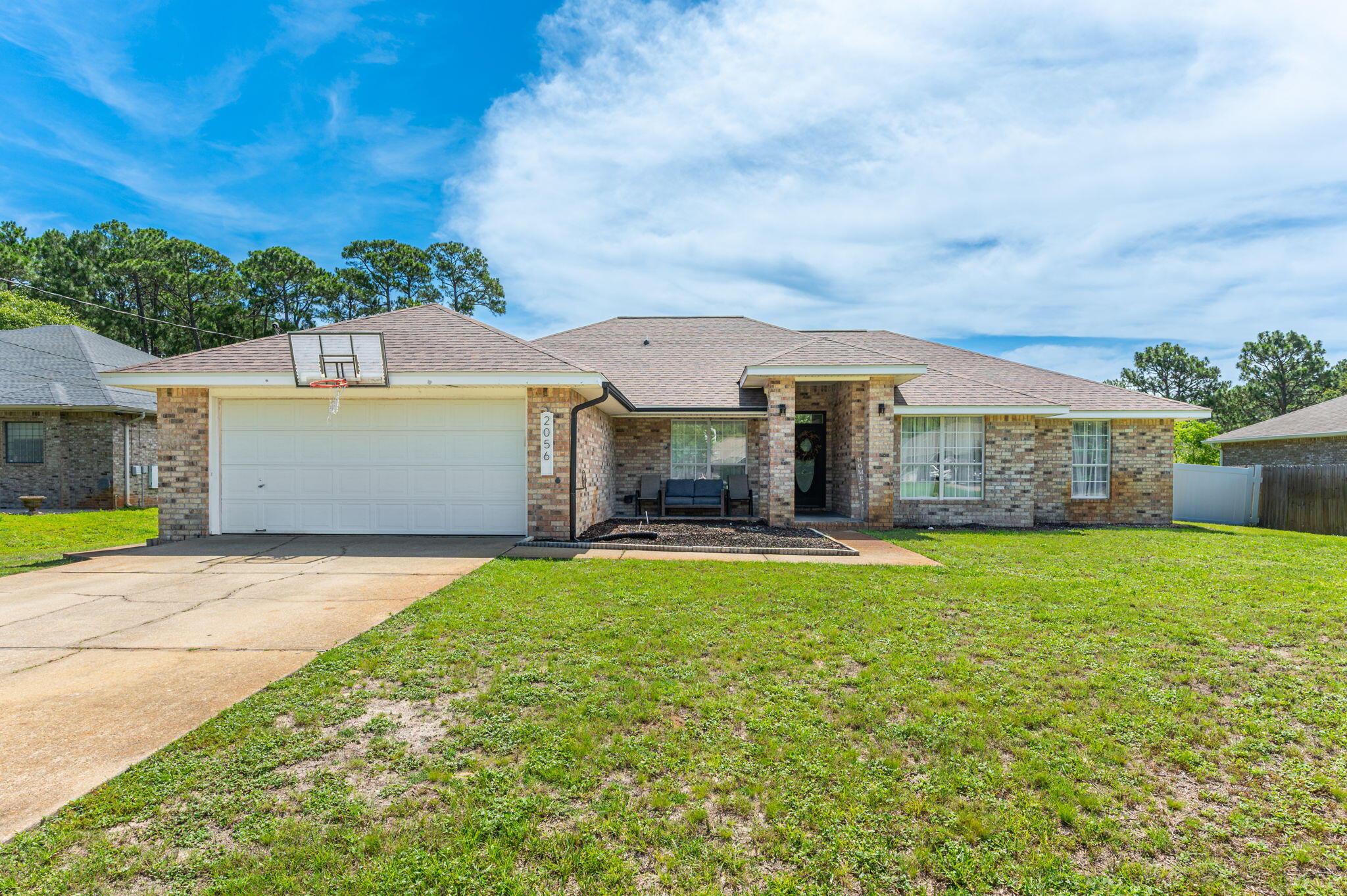 Screened Enclosed Pool w/ new pump and new filter! Holley by the Sea! Cul-de-Sac location!. 4 bedroom, plus office, and formal dining room, w 2 baths on large .46 Acre lot. Newly painted entrance wall and faux fireplace mantle, tiled flooring throughout, formal dining room that could be flex room, family room with high cathedral ceiling, double French Doors to another flex area that could be Den or Office. Kitchen has newer sink, newer range, dishwasher, microwave, and breakfast room overlooking pool.  Large primary bedroom with tiled shower and two shower heads, double vanity with two square sinks, framed mirror and two walk-in closets with built in shelves. 2022 Vinyl liner pool, 2017 HVAC, 2017 Water Heater and irrigation system. Opportunity to have all brick home with Pool close to the beach and not on a thoroughfare street. Did someone say amenities...? HTBS HOA ownership includes membership Ownership includes membership to Holley by the Sea's multi-million-dollar 45 acre recreational center with 8 clay tennis courts, 3 swimming pools, full gym, aerobics, summer camp, lighted basketball courts, sauna & steam room, playground game room, community house on Santa Rosa Sound with playground, dock, access to the East Bay boat launch and many community events. Only minutes to the pristine white sugar sand beaches and emerald water of the Gulf of Mexico.