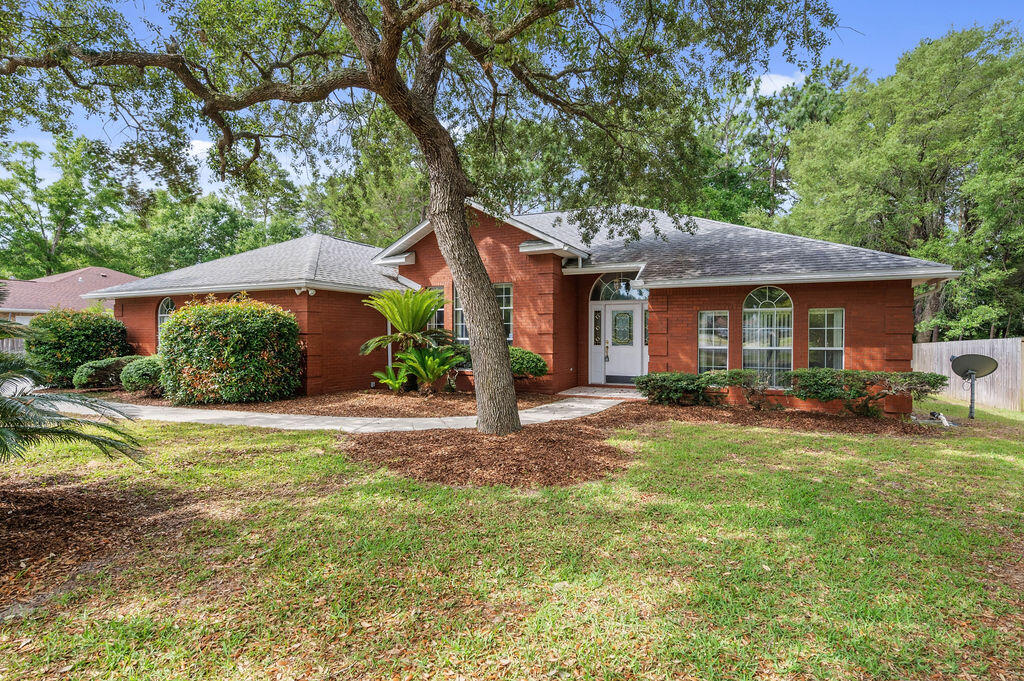 Located in the highly sought-after community of Niceville, this 3-bedroom, 2-bath all-brick home sits on a large .48-acre lot and features a split floor plan with a flex space just off the primary bedroom that could be used as a home office, nursery, workout room, craft room, or additional living space. Built in 1997, the home has already had several important updates completed, including a 2019 roof, 2019 air handler, and 2018 water heater.
The home includes a covered and screened-in porch that's great for relaxing or entertaining. The property also backs up to greenspace around a nearby shopping center, providing added separation behind the home. The neighborhood features sidewalk-lined streets and convenient access to Highway 20, making it easy to get to nearby schools, Eglin Air Force Base, shopping, dining, and the beaches of Destin.
With a practical layout, solid construction, and room to make it your own, this home offers a great opportunity to enjoy everything Niceville has to offer. All information is believed to be accurate but should be verified by buyers prior to purchase.