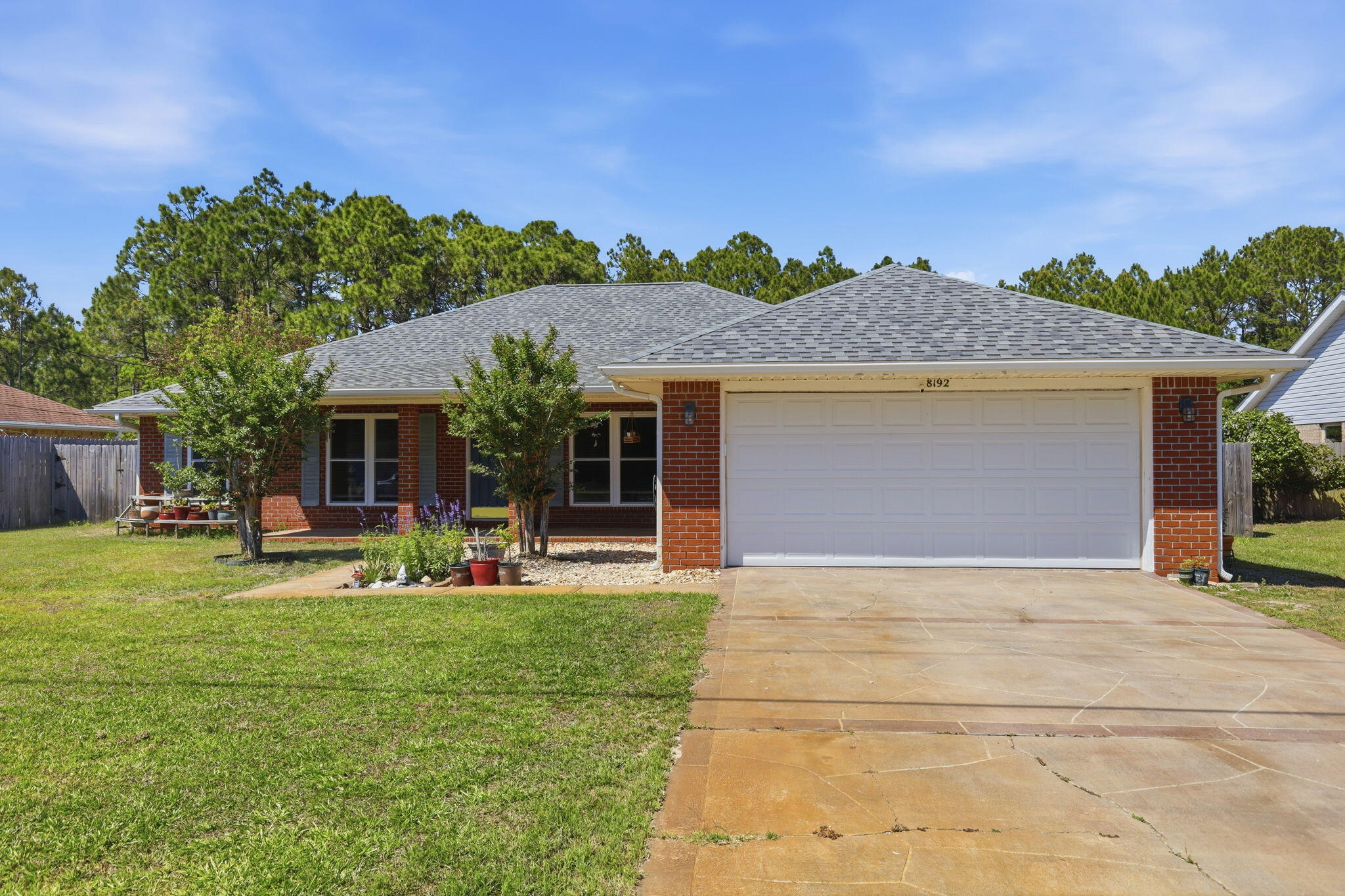 Welcome to this well-maintained, one-owner all-brick home in the heart of Navarre, sitting on nearly half an acre. With 4 bedrooms, 2 bathrooms, and over 2,500 square feet, this home offers a functional single-story layout with ceramic flooring and fresh interior paint. Major updates include a newer roof and upgraded hurricane windows. The backyard features a screened-in porch overlooking the pool with a new liner and freshly painted concrete. The spacious lot backs to wetlands with no direct rear neighbors, offering added privacy. Additional features include a 2-car garage and convenient proximity to Navarre High School, shopping, dining, and less than 10 minutes to Navarre Beach.