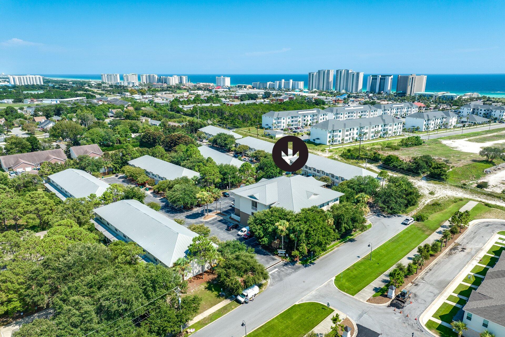 Seller incentive: 2026 HOA fees covered with acceptable offer!

Skip the Highway 98 traffic and start living! Positioned just 5 minutes from the beach and the new Publix via back roads. This move-in ready 2-bed, 2-bath condo offers a quiet escape in an intimate 18-unit building with rare elevator access.

Ideal for military (16 miles to Eglin/Hurlburt), first-time buyers, or investors maximizing long-term rentals.

Inside, enjoy an airy open plan with a tray ceiling, charming window alcove, and new carpet. The kitchen boasts fresh granite, stainless appliances, and a breakfast bar. Big-ticket peace of mind comes from PEX plumbing recently installed! Primary ensuite provides privacy and includes a built-in vanity/desk. In-unit laundry, plus washer/dryer convey.

Zero yardwork and an unbeatable location - more beach days and less traffic delays!