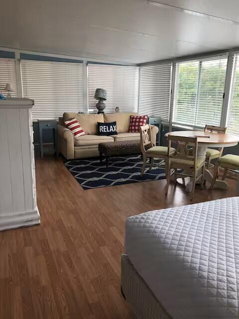 This property comes fully furnished and completely stocked, offering an immediate income opportunity as a turn-key vacation rental, or a seamless transition into your new full-time residence.

Prime Location & Curb Appeal
Steeped in coastal charm, the property welcomes you with an inviting white picket fence entrance. Situated in a highly desirable area, you are just a short, easy walk from both the emerald waters of the Gulf of Mexico and the peaceful shores of the Sound.

Main Level Living
The thoughtfully designed first floor features an open and airy layout. It includes a spacious kitchen that flows seamlessly into the main living and dining areas, making it ideal for entertaining. The coveted first-floor master bedroom provides a private and accessible sanctuary away from the upstairs living spaces.

Expansive Second Floor
Upstairs, you will find an abundance of space. The second floor boasts two additional well-appointed bedrooms and a massive secondary living area. This flexible space is perfect for a media room, game room, or extra guest lounge to maximize rental capacity.

Unbeatable Outdoor Space & Parking
Outdoor living is where this property truly shines. The exterior features a beautifully designed patio complete with a wooden pergola dining area, perfect for alfresco meals and evening relaxation. Storage is never an issue with a dedicated additional outdoor storage shed.
Best of all, the property includes four dedicated parking spaces. This massive driveway eas