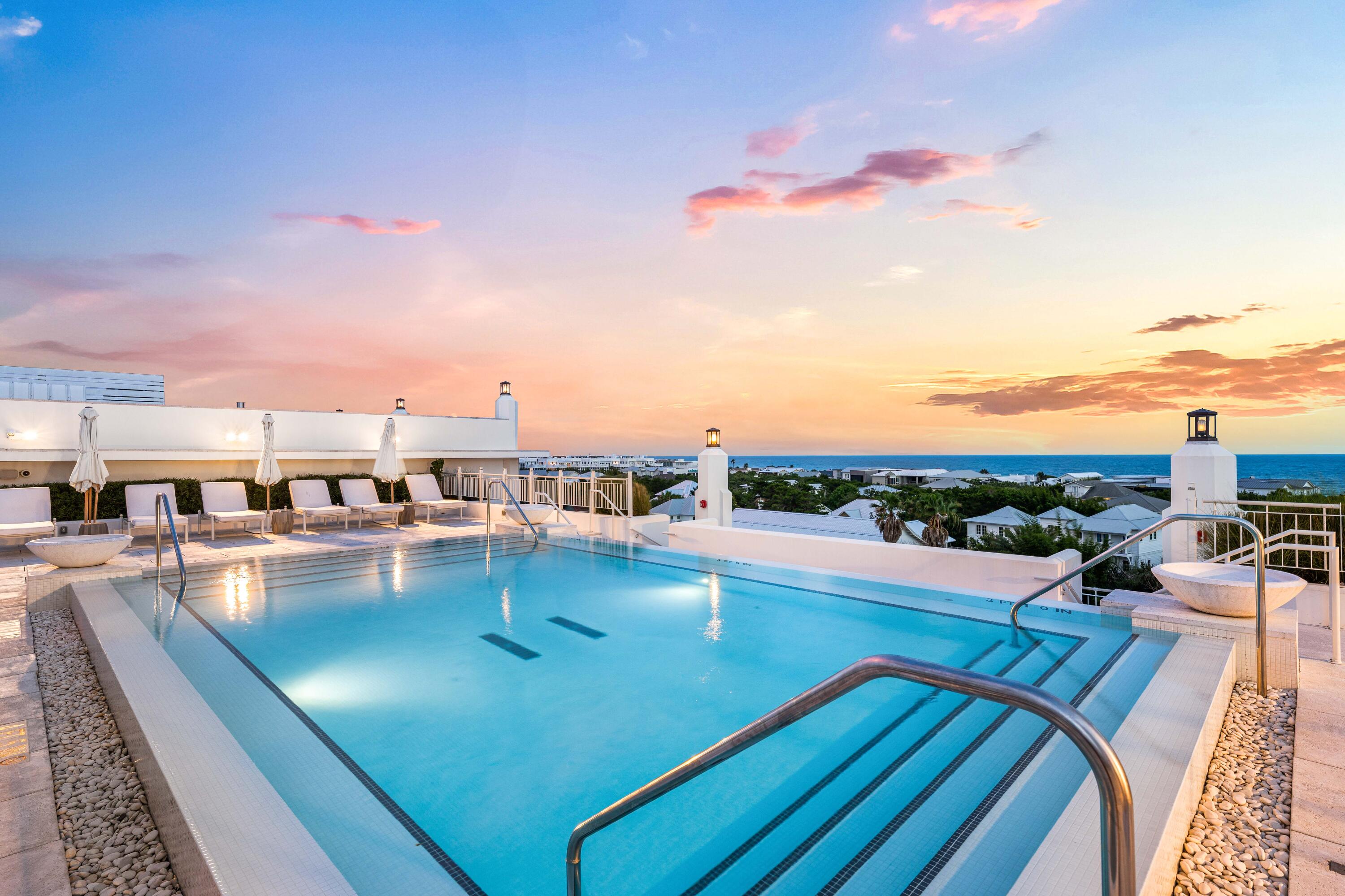 Positioned on the third floor of Kaiya Club Residences, Unit 307 offers 1,358 square feet of Gulf-view living with a fully furnished interior ready to enjoy from arrival. Gulf views flow from the great room through the primary suite and out to the covered balcony -- a consistent outlook that distinguishes this residence within the building.
The covered balcony is a genuine outdoor room. Deep, tiled in large-format stone, and furnished in teak -- high-top dining, barrel lounge chairs, and a chaise -- it looks south across the 30A roofline to the Gulf and west toward the white architecture of Alys Beach. Two distinct seating areas make it equally suited for morning coffee and evening entertaining.
Inside, French doors open the great room directly to the balcony, with wide-plank hardwood floors running throughout. Slipcovered sofas, a solid walnut coffee table, and upholstered accent chairs -- all Restoration Hardware, all conveying with the sale -- give the space a settled, editorial quality that arrives fully formed.
The chef's kitchen is anchored by a Wolf professional gas range set against a full-slab backsplash, with Sub-Zero refrigeration and full-height flat-panel cabinetry in dove grey. An oversized quartz island with shiplap-wrapped base seats four beneath a statement brass ring pendant. Just off the kitchen, a dedicated wet bar with underlit glass-front cabinetry, a quartz counter, and a bar sink is designed for seamless entertaining without disrupting the main kitchen Both bathrooms are finished entirely in Carrara marble. The primary bath features a dual vanity with fluted cabinetry and a walk-in rain shower. The guest bath continues the same marble palette with a full soaking tub under a glass enclosure -- a detail more at home in five-star hospitality than a residential condominium.
The primary suite opens through French doors directly to the balcony with Gulf views from the bed. The secondary bedroom is equally refined, with hardwood floors and ample closet storage.
The rooftop pool, sun deck, and Wolf outdoor kitchen are available to all Kaiya Club Residences owners. Kaiya Club membership is available separately at an additional cost and provides access to the private Gulf-side beach house and a second resort pool. The Kaiya grounds feature a formal cobblestone arrival, illuminated fountain gardens, and a fire feature courtyard. Directly adjacent to Alys Beach, minutes from Rosemary Beach, and steps from the 19-mile 30A bike path.