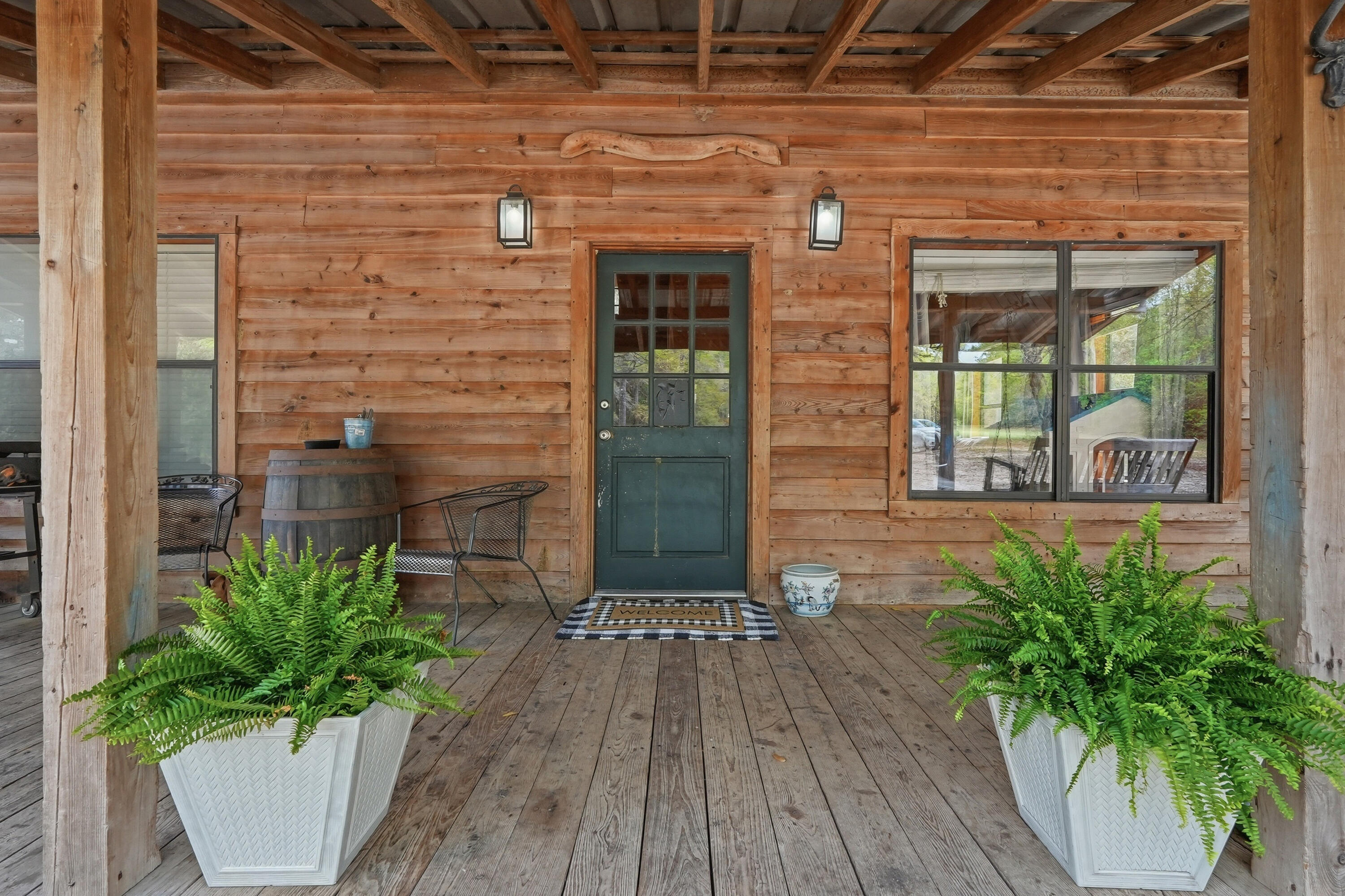 Escape to the tranquility of country living in this charming custom-built cabin set on a sprawling 10-acre parcel. This two-story rustic home is surrounded by natural beauty and offers a unique setting of privacy and peaceful surroundings. Envision gardening, enjoying outdoor recreation, or relaxing among nature. A large workshop and carport are included. Step inside to discover a warm and inviting interior, featuring abundant natural light, impressive woodwork, an open living space and tall cathedral ceilings. The primary bedroom is located on the first floor, with additional bedrooms on the second floor in a loft-style setting. Whether you are looking for a full-time residence or a weekend getaway, this unique country property offers a rare opportunity to own your own slice of paradise.