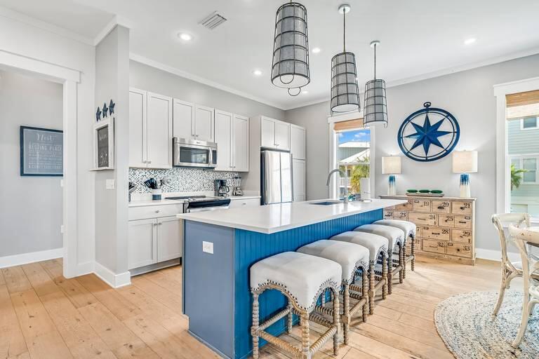 Positioned on a premier corner lot along Beachcomber Lane, this exceptional property borders green space and offers front-row views of Seacrest Beach's newly designed Town Hall, amphitheater lawn, curated dining and gathering spaces. Ideally located between Alys Beach and Rosemary Beach, this setting places you at the heart of 30A's most coveted stretch and evolving coastal lifestyle.
This 5-bedroom residence is thoughtfully designed with a light-filled open layout and seamless indoor-outdoor living, complemented by expansive porches and outdoor spaces ideal for entertaining and relaxing. A highly desirable feature includes three private primary bedroom suites, offering enhanced comfort and privacy for multiple guests--an ideal configuration for both personal use and maximizing rental appeal.
Offered fully furnished and rental-ready, this turnkey property presents immediate income potential with projected rental revenue up to $148,000 annually. Enjoy close proximity to the deeded beach access and resort-style amenities, including the iconic 12,000 sq ft lagoon pool, tram service, and pedestrian-friendly pathways--all designed to elevate the Seacrest experience. A rare opportunity to own in one of 30A's most dynamic locations, where lifestyle, luxury, and investment potential align. This is a must-see--schedule your private showing today.