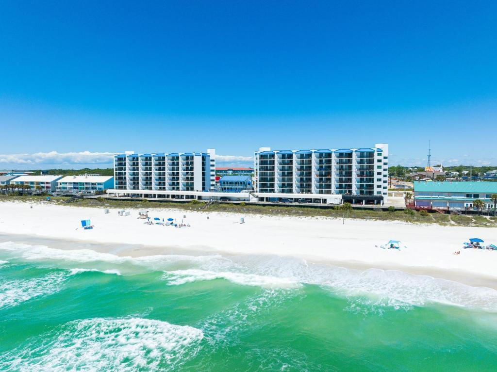 Welcome to this one-of-a-kind Gulf-front condo at the iconic AquaVista! This beautifully updated unit features a Gulf-front flex space that has been converted into a third bedroom (see remarks), offering extra room for family and guests. Thoughtfully renovated, the condo now boasts new luxury vinyl plank flooring throughout (except bathrooms), upgraded fixtures in the living room and kitchen, a brand-new washer and dryer, and an updated electrical panel brought up to code. Inside, you'll find modern finishes and stylish furnishings that make this condo truly turn-key and vacation ready. Step out onto the spacious balcony to unwind and take in unforgettable sunsets over the emerald waters of the Gulf of Mexico. With prime proximity to Panama City Beach's best restaurants, shopping, and attractions, you'll have endless entertainment just minutes away. Offered fully furnished with rentals already on the books for the season, this property is the perfect blend of luxury, convenience, and relaxation. Whether you're looking for a second home, a rental investment, or a personal retreat, this condo is a dream come true for Gulf-front living.