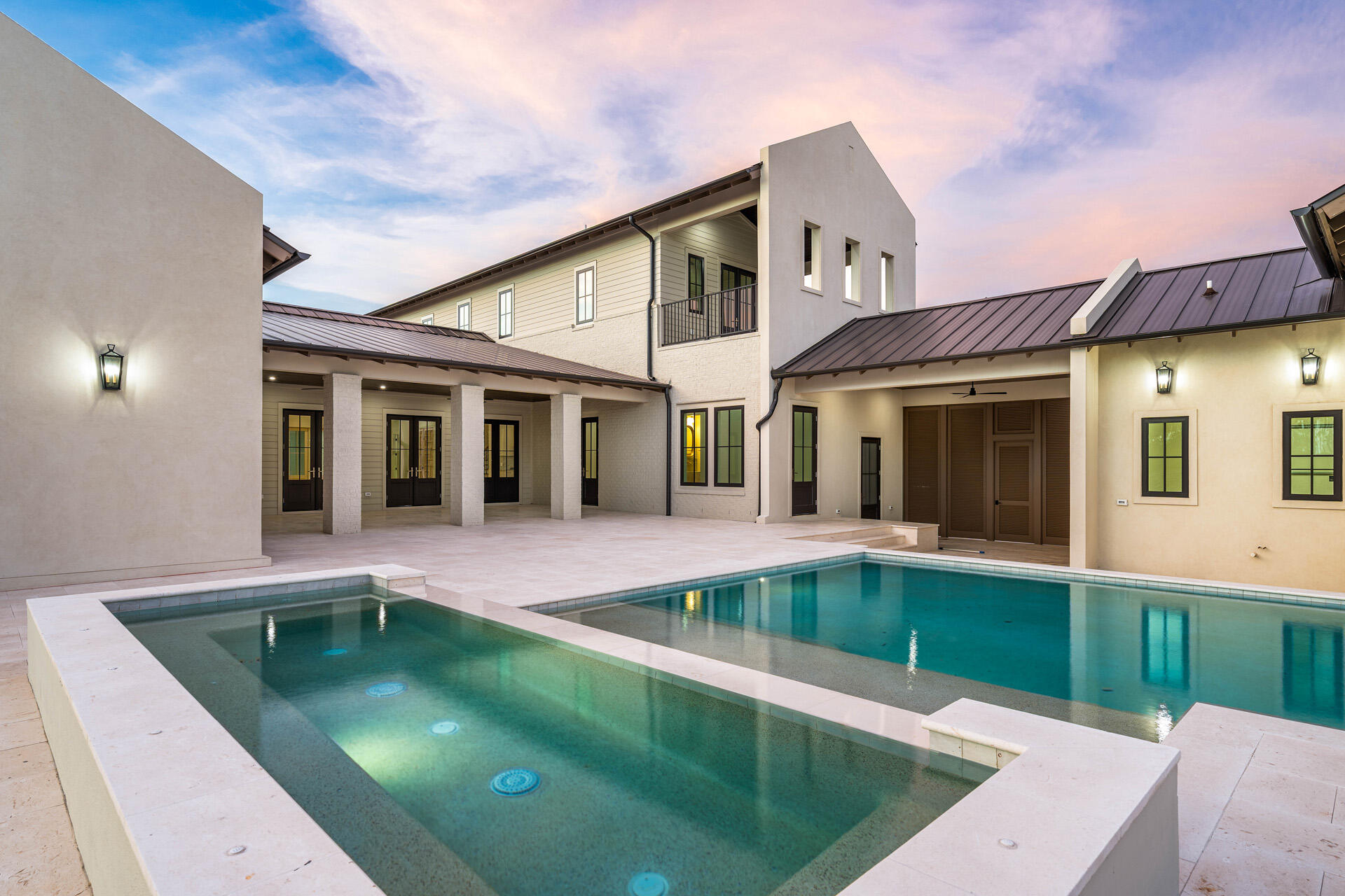 A showstopper of modern coastal elegance, 36 Sand Court Drive is a brand-new luxury estate within the gated enclave of Watersound Camp Creek. Spanning 6,065 square feet with five bedrooms and six-and-a-half bathrooms, this two-story residence was designed to live like a private resort. The exterior showcases a refined blend of white stucco, brick, and cedar lap siding, while a brick courtyard wall and mahogany entry doors create an impressive sense of privacy and arrival.

Inside, a private elevator, dedicated office, and dramatic living room with vaulted ceilings and architectural columns open to an exceptional backyard sanctuary. The resort-style pool features a wall fountain, sun shelf, and swim-up serving area connecting directly to the outdoor kitchen and bar. The outdoor kitchen materials and appliances have been delivered and installation is underway. A dedicated gas connection is also in place for the future addition of a fire-lounge feature, allowing the next owner to further customize the pool deck for evenings of outdoor relaxation and entertaining. The oversized corner lot is framed by a wraparound driveway, lush landscaping, and two elegant courtyards, including an entry courtyard with a tranquil fountain. The first-floor primary suite occupies an entire west wing of the home and offers vaulted ceilings, a stone fireplace, private access to the pool deck, two spacious walk-in closets, a bonus washer and dryer hookup, and a separate dressing room. Its spa-inspired bathroom features a freestanding soaking tub, an expansive open walk-in shower, and a distinctive freestanding double vanity positioned away from the wall, allowing it to be accessed from both sides while facing a full mirrored wall.

A private guest suite on the opposite side of the first floor provides its own courtyard access and a beautifully appointed bathroom with a soaking tub, walk-in shower, and dual vanities.

Upstairs, three additional bedrooms each feature private ensuite bathrooms. Two include vaulted ceilings, while the pool-facing suite offers the size and amenities of a second primary retreat. This spacious bedroom features vaulted ceilings, a private balcony overlooking the pool deck and backyard, and an impressive bathroom with dual vanities, a freestanding soaking tub, and a full walk-in shower.

Thoughtful architectural details, premium finishes, and generously proportioned spaces throughout create a seamless balance of luxury, comfort, and everyday livability. From the private bedroom suites and elegant courtyards to the resort-inspired outdoor setting, every element has been designed for elevated coastal living.

Located behind the exclusive gates of Watersound Camp Creek, ownership offers more than an extraordinary home--it provides access to one of Northwest Florida's most sought-after lifestyles. Property ownership includes eligibility for the Watersound Club, with membership options offering access to an array of amenities that may include private beach experiences, championship golf, pools and a lazy river, wellness facilities, tennis, pickleball, and signature dining venues.

36 Sand Court Drive is more than a residence--it is a statement of refined living and timeless comfort along Florida's Emerald Coast. Experience privacy, luxury, and an entertainer's dream within the exceptional Watersound Camp Creek community.