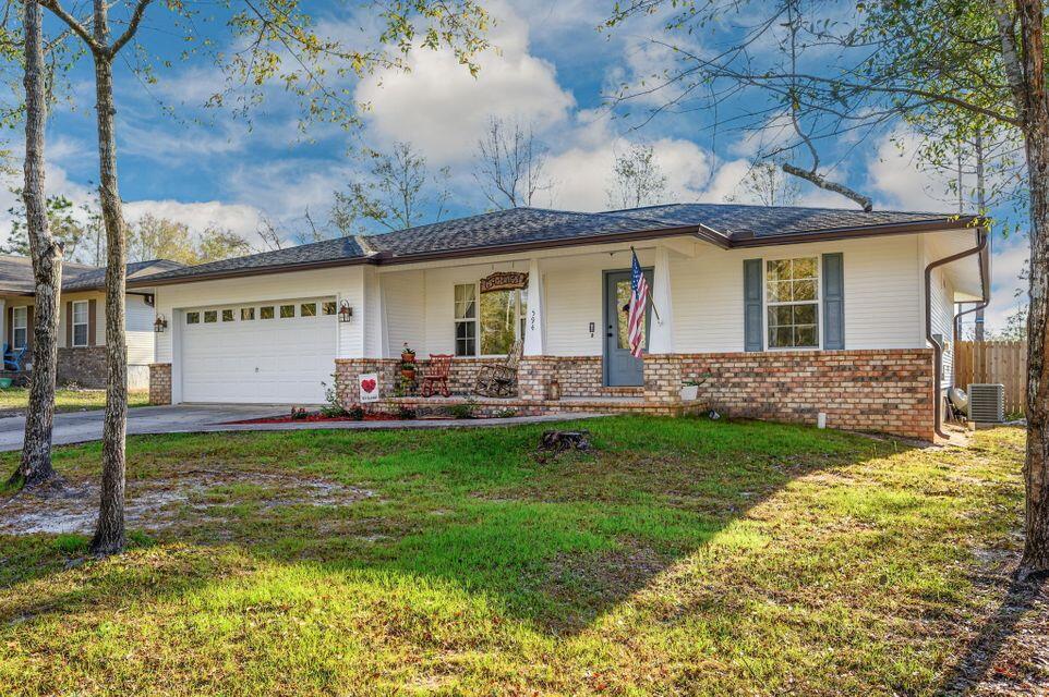 Beautiful home in the city limits of Defuniak Springs & just under an hour to our beautiful white sandy beaches. Conveniently located just behind the high school, walking distance to the elementary school and Wee Care Park making it the perfect location. Nice open floor plan with all new carpet, galley style kitchen, pantry, large laundry room, 2 car garage, fenced back yard and covered back porch. It is also a split floor plan for seclusion in the master suite.