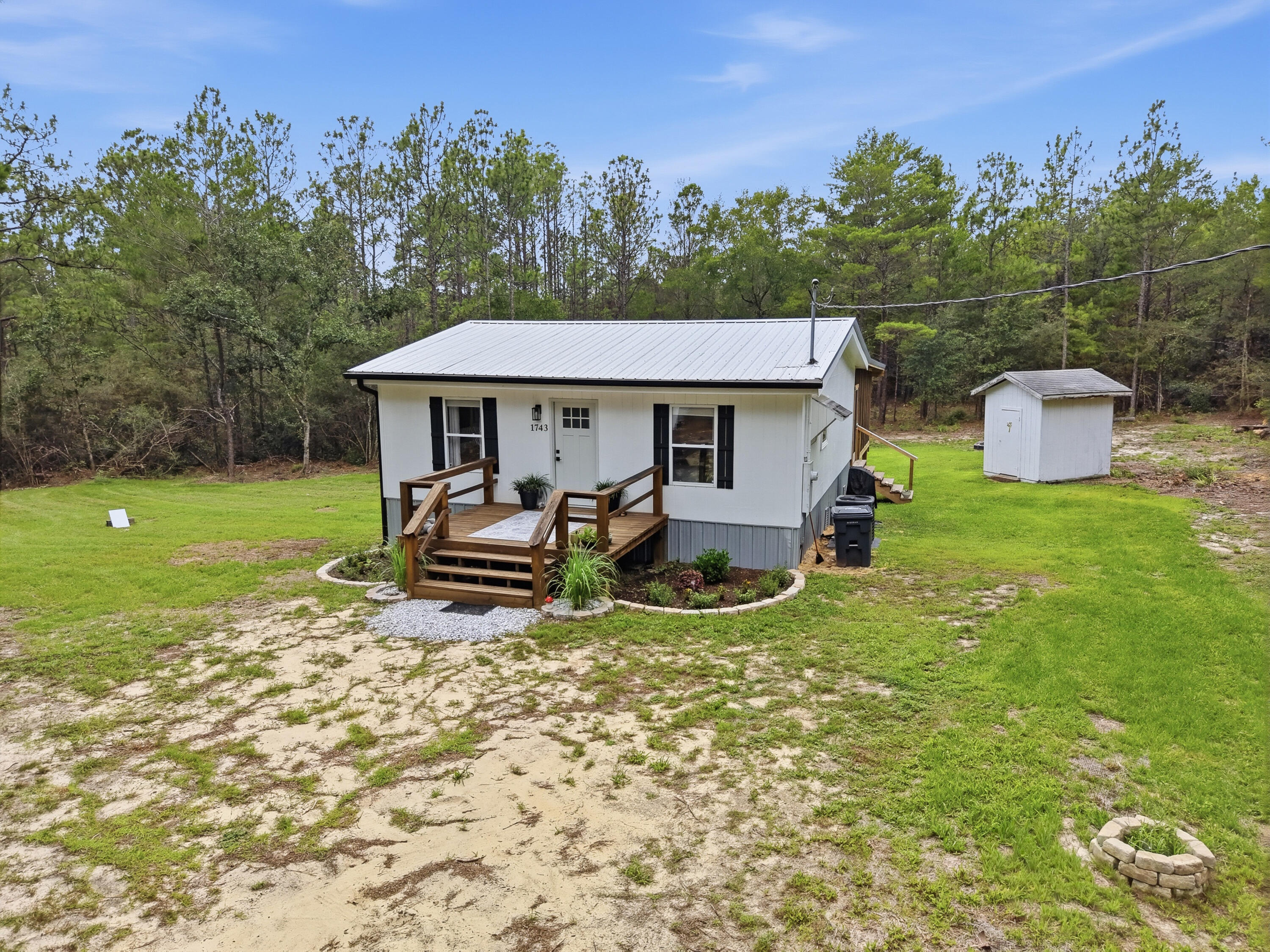 Country living meets modern comfort on nearly 5 acres! If you've been searching for a move-in ready home with land, privacy, and room to enjoy the outdoors, this updated home is a must see.
Thoughtfully renovated from top to bottom, the home features a new metal roof, new HVAC, updated flooring, new appliances, white shaker soft close cabinetry, quartz countertops, center island and a beautifully remodeled bathroom. Every detail has been designed to maximize comfort and style.
One of the standout features is the spacious screened porch perfect for entertaining, relaxing with family and friends, or enjoying peaceful mornings overlooking your property. A front deck provides even more outdoor space.
Approximately 2 acres cleared, creating usable space for a garden, workshop, recreational vehicles or add a pool. Solar powered entry gate adds to the privacy.
Just minutes to major highway 90 and 285/I10 and approximately 15 minutes to historic downtown Defuniak Springs, shopping and restaurants.
Call for your private showing today.