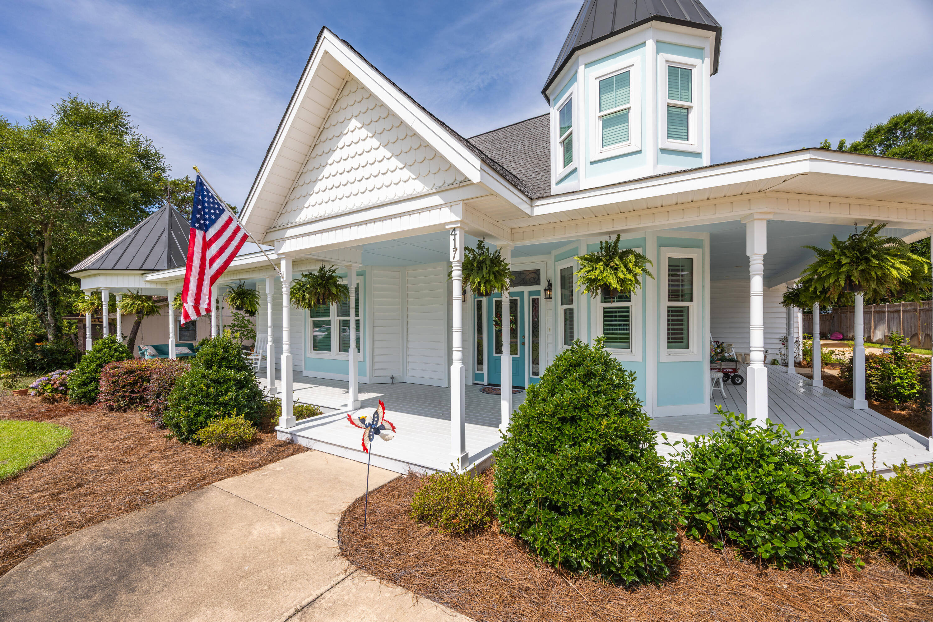Experience the charm and character of this exceptional Victorian-inspired residence, masterfully built by acclaimed local builder David Meyer. Showcasing timeless architecture, a distinctive turret, and an inviting wrap-around porch, this home blends classic elegance with modern comfort in a highly desirable location near the Emerald Coast's renowned beaches, shopping, and dining.  Inside, the thoughtfully designed floor plan offers seamless flow between the living, dining, and kitchen areas, creating the perfect setting for entertaining and everyday living. A cozy fireplace anchors the main living space, while the chef's kitchen impresses with quartz countertops, stainless steel appliances, a gas cooktop, custom cabinetry, and stylish designer finishes.  The formal dining room is truly unforgettable, highlighted by a stunning domed ceiling featuring hand-painted cloud details that add a touch of artistry and sophistication. The spacious first-floor primary suite serves as a private retreat, complete with a sitting area, spa-inspired bath, dual vanities, an oversized walk-in closet, and a relaxing soaking tub.  Upstairs, you'll find three additional bedrooms along with the home's signature turret room--a magical space ideal as a reading nook, home office, or creative retreat.  One of only five beautifully crafted Victorian-style homes on the street by the same respected builder, this property offers a rare opportunity to own a truly distinctive residence. Enjoy convenient access to world-class fishing, sugar-white beaches, premier shopping, excellent dining, and all that the Emerald Coast lifestyle has to offer.