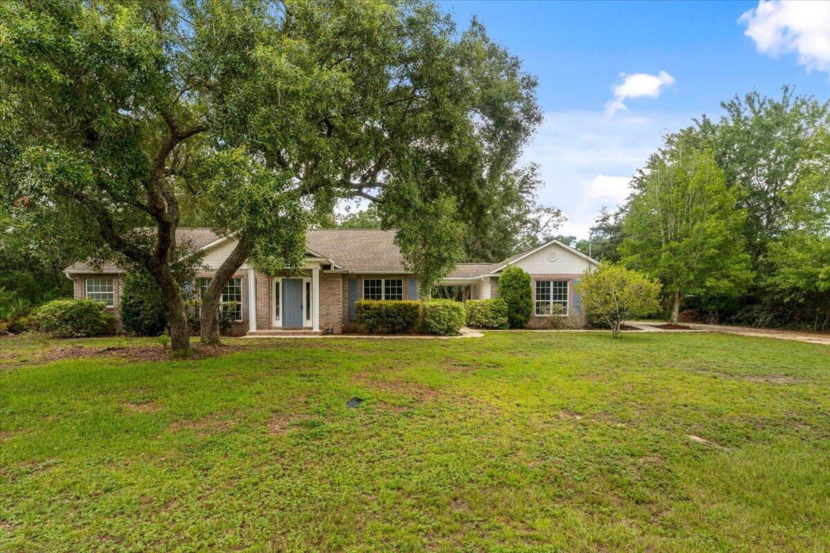 Welcome home to this beautifully maintained 3-bedroom, 2-bath residence nestled on an oversized whole acre corner lot in the highly sought-after Holley by the Sea community. Featuring a desirable split-bedroom floor plan, this home offers a comfortable layout with spacious living areas that flow seamlessly for everyday living and entertaining. 

Enjoy your morning coffee or unwind in the evenings from the screened porch overlooking the expansive wooded backyard, providing both privacy and plenty of room to enjoy the outdoors. A detached two car garage with covered breezeway adds style to the home. 

Major updates have already been completed for  peace of mind, including a new roof  in 2020, along with a newer HVAC (3-4 yrs) and new water heater in 2022. 

Schedule your private showing today!