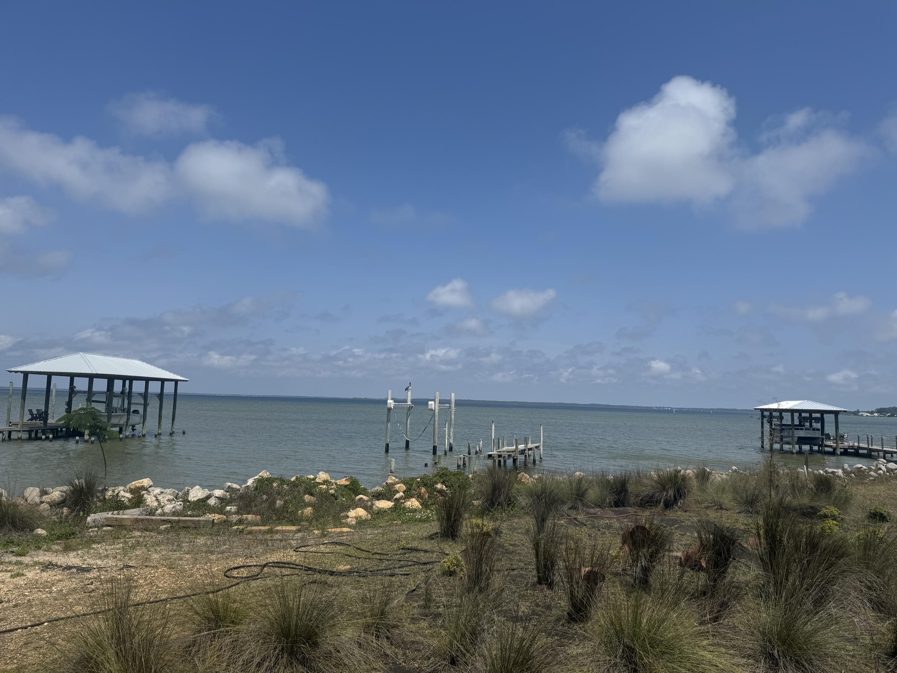 Exceptional opportunity to own a vacant, level bayfront lot in the highly desirable Turquoise Beach community of Santa Rosa Beach. This homesite offers stunning, unobstructed water views and the perfect setting to build your custom coastal retreat. The seawall has been reinforced in recent years with durable granite rip rap, providing added protection and long-term peace of mind. Architect-designed house plans, created specifically for this homesite, are available--making it even easier to bring your vision to life. No HOA, offering added flexibility and freedom. Enjoy tranquil surroundings, breathtaking sunsets, and direct bay access in one of the area's most sought-after locations.