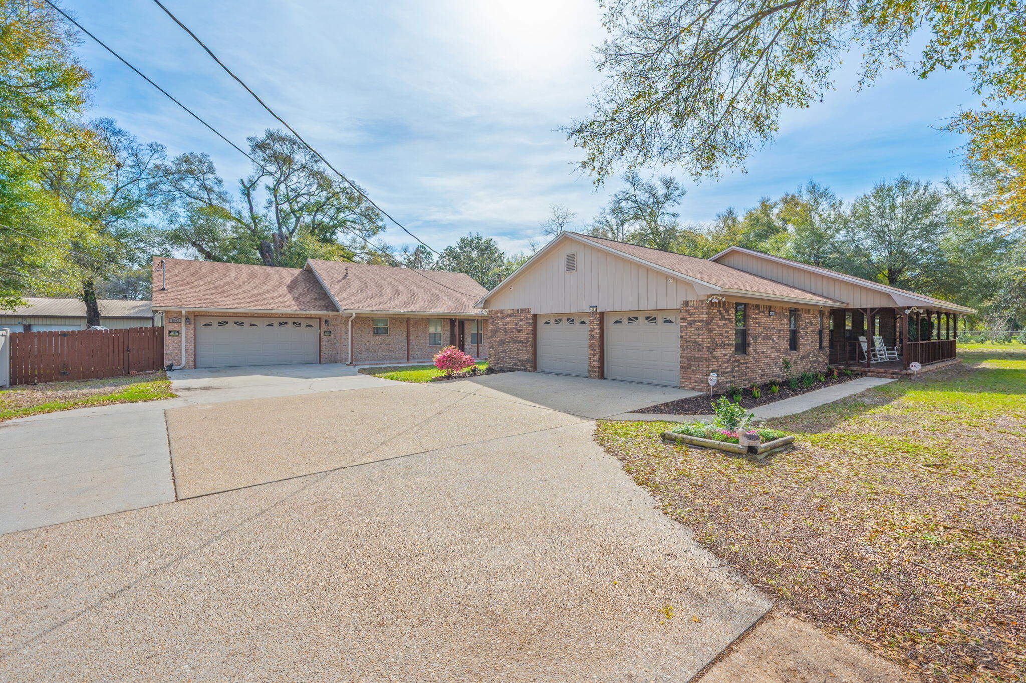Welcome to 4841 & 4843 Antioch Rd--an exceptional opportunity to own a versatile 2.45-acre property on the desirable south side of Crestview! This unique offering features a beautifully maintained main home plus a fully equipped cottage, perfect for multi-generational living, rental income, or guest accommodations.

The main residence boasts 2,836 square feet of thoughtfully designed living space, including 3 spacious bedrooms and 2 full bathrooms. You'll love the open-flow layout connecting the living room, dining area, and kitchen--ideal for both everyday living and entertaining. The kitchen features Corian countertops, a large breakfast bar, and abundant cabinet space. Additional highlights include a dedicated office, a generous laundry room with a utility sink and pantry storage, and a mudroom off the garage with extra cabinetry for added convenience. A large bonus room/den at the rear of the home provides flexible space for a second living area, playroom, gym, or media room.

Step outside to an AMAZING back deck that seamlessly connects to the charming cottage. The 990 sq. ft. cottage offers 1 bedroom, 1.5 bathrooms, a full kitchen, and its own oversized two-car garage, making it an incredible standalone living space. An additional bonus to this space is that the cottage is equipped with a backup generator. 

The backyard is fully enclosed with a top-of-the-line vinyl fence down one side, complemented by chain link, and the property includes an RV hookup for added flexibility. Freshly painted and full of charm, this property combines space, function, and endless possibilities all in a peaceful setting.

Don't miss your chance to own this one-of-a-kind property! (Home has a hardwired surveillance system that will convey AS-IS)