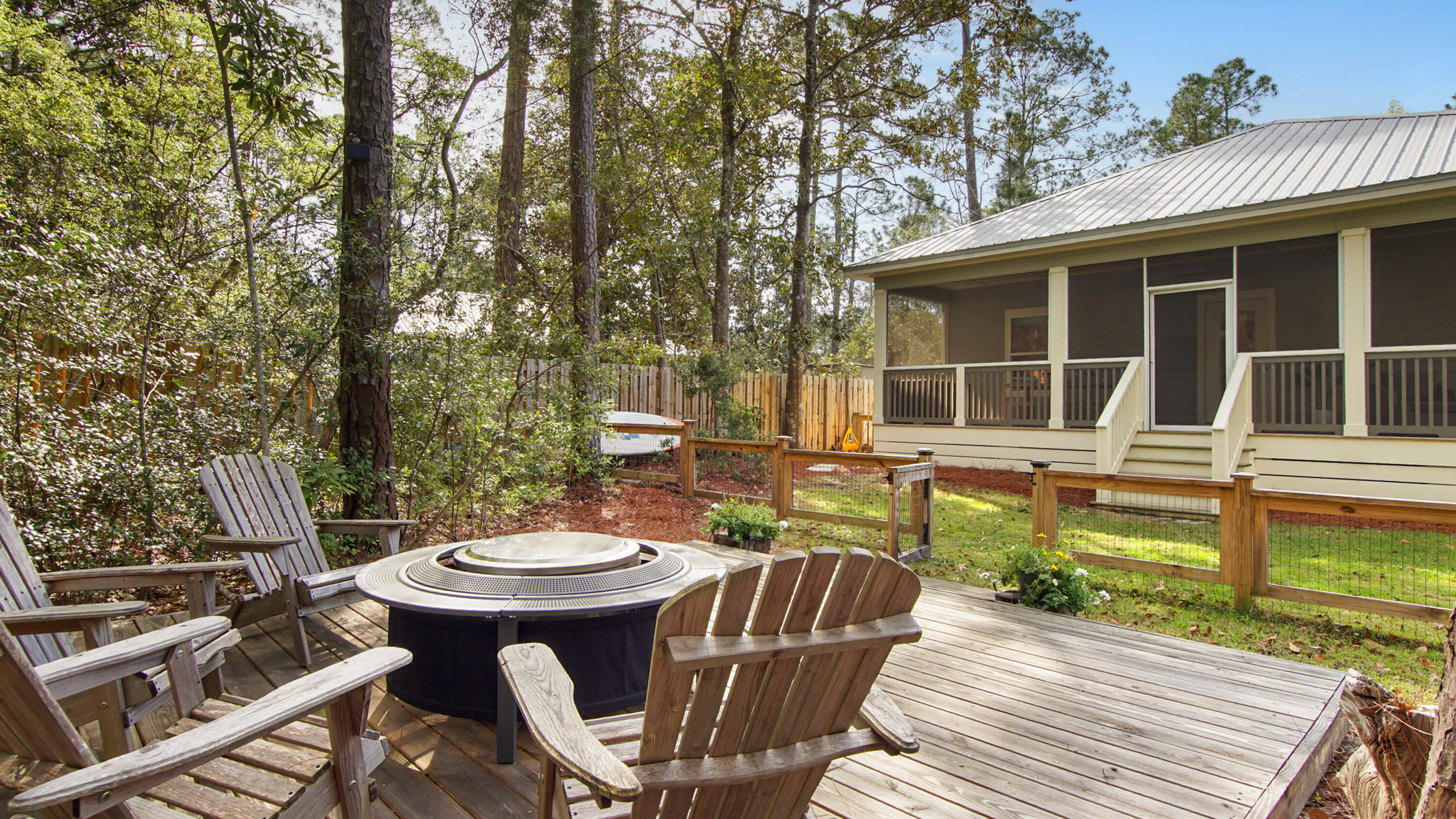Welcome to the highly desirable Point Washington area of Santa Rosa Beach, just minutes from the white sand beaches of 30A! This charming cottage features an open floor plan with 3 bedrooms and 2 bathrooms, perfect for comfortable living and entertaining. The kitchen offers stainless steel appliances, quartz countertops, tile backsplash, and a spacious walk-in pantry. The light-filled primary suite includes a large closet and en-suite bath with custom tile, double vanity, and walk-in shower. Enjoy relaxing on the large porches overlooking a private wooded backyard with fire pit. Conveniently located near beach, schools, shopping, dining, and close to Choctawhatchee Bay for boating, fishing, and beautiful sunsets. This home is perfect for full-time, part-time or investment rental property.