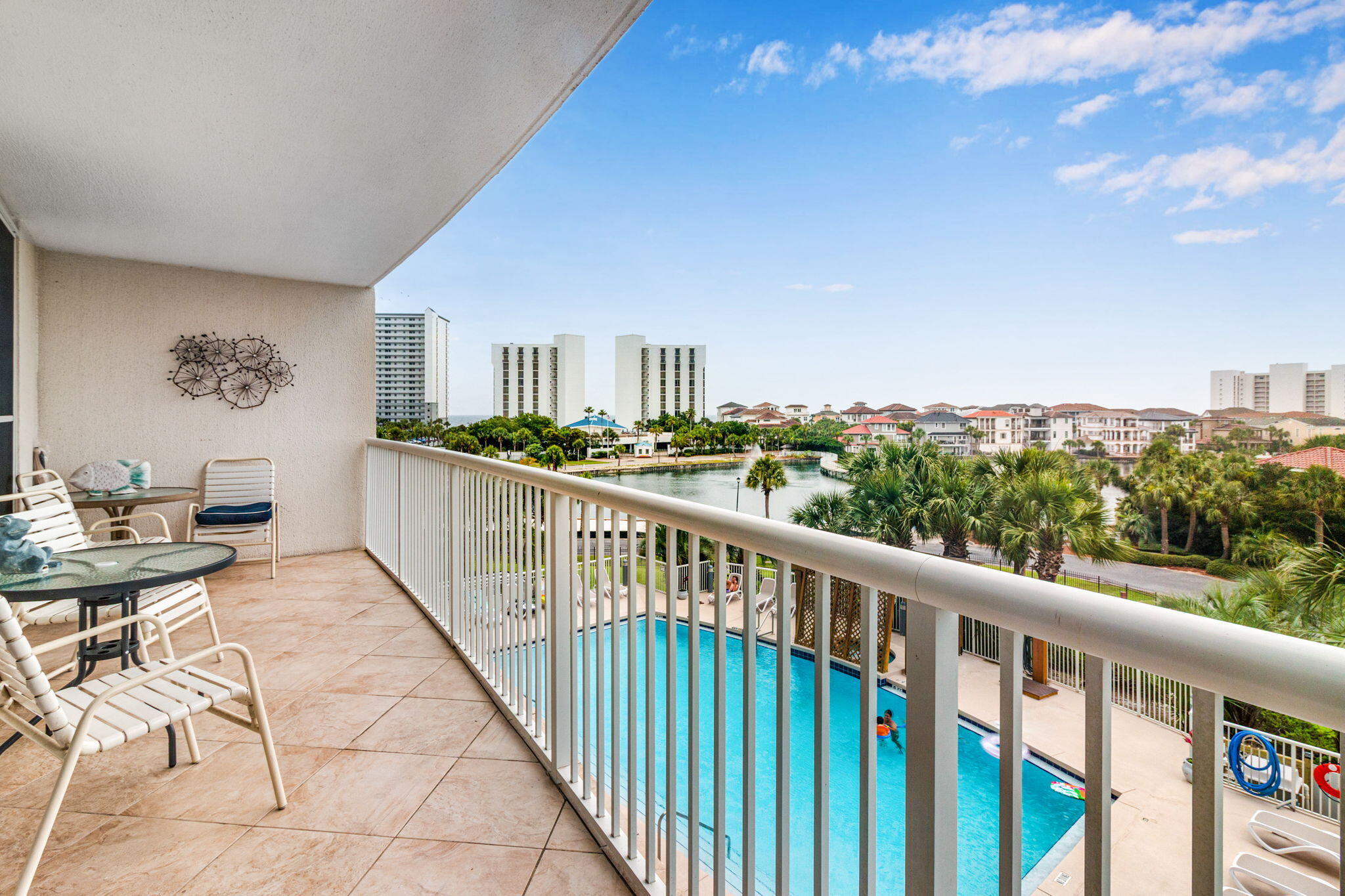 Getting access to one of Destin's most popular beachfront resorts usually comes with a much higher price tag. Terrace at Pelican Beach 303 offers one of the most affordable opportunities to enjoy the full Pelican Beach lifestyle while remaining in the heart of Destin.

Located just a short walk from the sugar-white sand and emerald waters of the Gulf of Mexico, owners and guests enjoy private deeded beach access along with access to an impressive collection of resort amenities. Spend your days relaxing at one of three pools, soaking in one of three hot tubs, enjoying lunch at the Pelican Beach Cafe, grabbing a drink at the Tiki Bar, or taking advantage of the fitness centers, tennis courts, pickleball courts, game room, and more.

One of the property's most appealing features is its location within The Terrace. Currently the lowest-priced unit available in the building, it provides an attractive entry point into a highly sought-after resort community without sacrificing access to the amenities that make Pelican Beach one of Destin's most recognized vacation destinations. This unit is extremely clean and has been expertly maintained. Due to the layout and the tall ceilings this unit also feel much bigger than the listed square footage. The position of the unit within the building allows you to be connected to the pool while on the balcony and enjoy spectacular sunsets in the evening.  Beyond the beach, this residence enjoys views stretching down Destin Harbor toward the Destin Bridge, creating a unique perspective that captures the energy of the harbor and beautiful western sunsets. Combined with its central Destin location, owners are just minutes from shopping, dining, entertainment, boating, fishing, and everything that has made Destin one of Florida's premier coastal destinations.

Whether you're looking for a second home, vacation retreat, or investment property, Terrace at Pelican Beach 303 offers something increasingly difficult to find in today's market: affordable access to a premier resort community with private beach access and an unmatched collection of amenities.