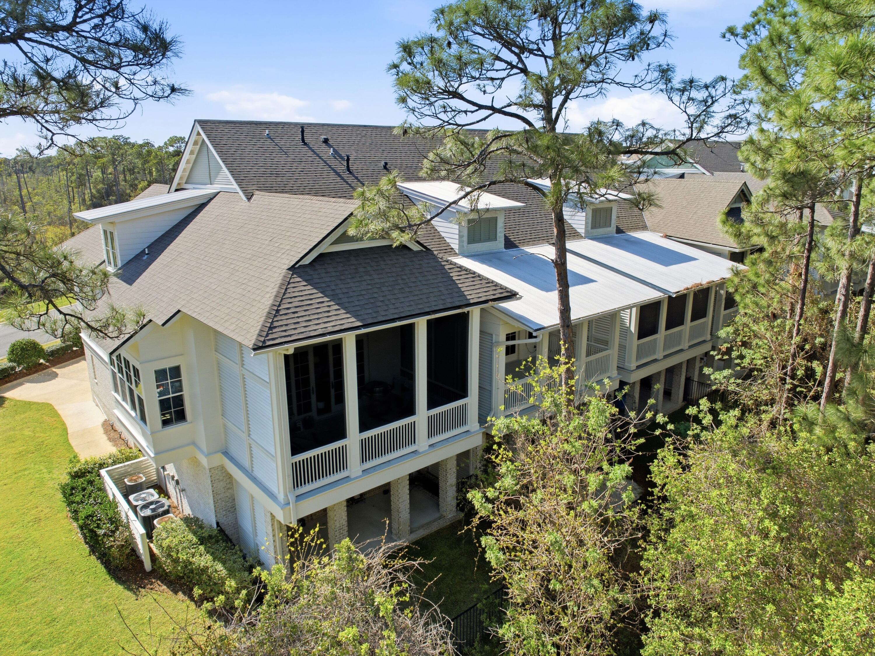 Discover refined coastal elegance in this beautifully designed three bedroom, two full bath, and one half bath townhome, offering 2,658 square feet of sophisticated living within the exclusive, gated community of Kelly Plantation. Ideally positioned with convenient access to the side gate, the location allows for a quick drive across the Mid-Bay Bridge and easy access to shopping and dining at Destin Commons, all while remaining just minutes from the sugar-white beaches of the Emerald Coast. Thoughtfully designed to live like a single-family home, the interior features an open-concept layout with soaring 10-foot ceilings, wide-plank hardwood floors, and a light, airy palette. The main living area is both inviting and refined, centered around an electric fireplace insert with elegant shiplap detailing and a custom wood mantle. Large openings lead to a covered porch overlooking a serene natural preserve, offering a peaceful and private backdrop.

The gourmet kitchen serves as the heart of the home, appointed with quartz countertops, a spacious island with designer lighting, premium stainless appliances, a gas cooktop, and custom cabinetry designed for both everyday living and entertaining. A dedicated dining area completes the space with a natural, effortless flow.

Upstairs, the primary suite offers a private retreat, with French doors opening to a covered balcony. The ensuite bath features a soaking tub, walk-in shower, dual vanities, and a generous walk-in closet. Two additional bedrooms and a full bath provide comfortable accommodations, while the third-floor bonus room offers flexibility for a media room, office, or fitness space.

Outdoor living is complemented by a small fenced yard, ideal for pets or children, along with low-maintenance landscaping that enhances the home's lock-and-leave appeal. Additional features include a two-car garage, a well-appointed laundry room with utility sink, and thoughtfully integrated storage throughout.

Residents of Kelly Plantation enjoy access to an exceptional collection of amenities, including a championship golf course, scenic walking trails, pickleball, and five well-maintained clay tennis courts with LED lighting for evening play, along with a bayfront boardwalk, resort-style pool, fitness center, and clubhouse.

This residence offers a rare opportunity to own a move-in-ready home in one of Destin's most established gated communities, combining thoughtful design, convenience, and a strong sense of place.