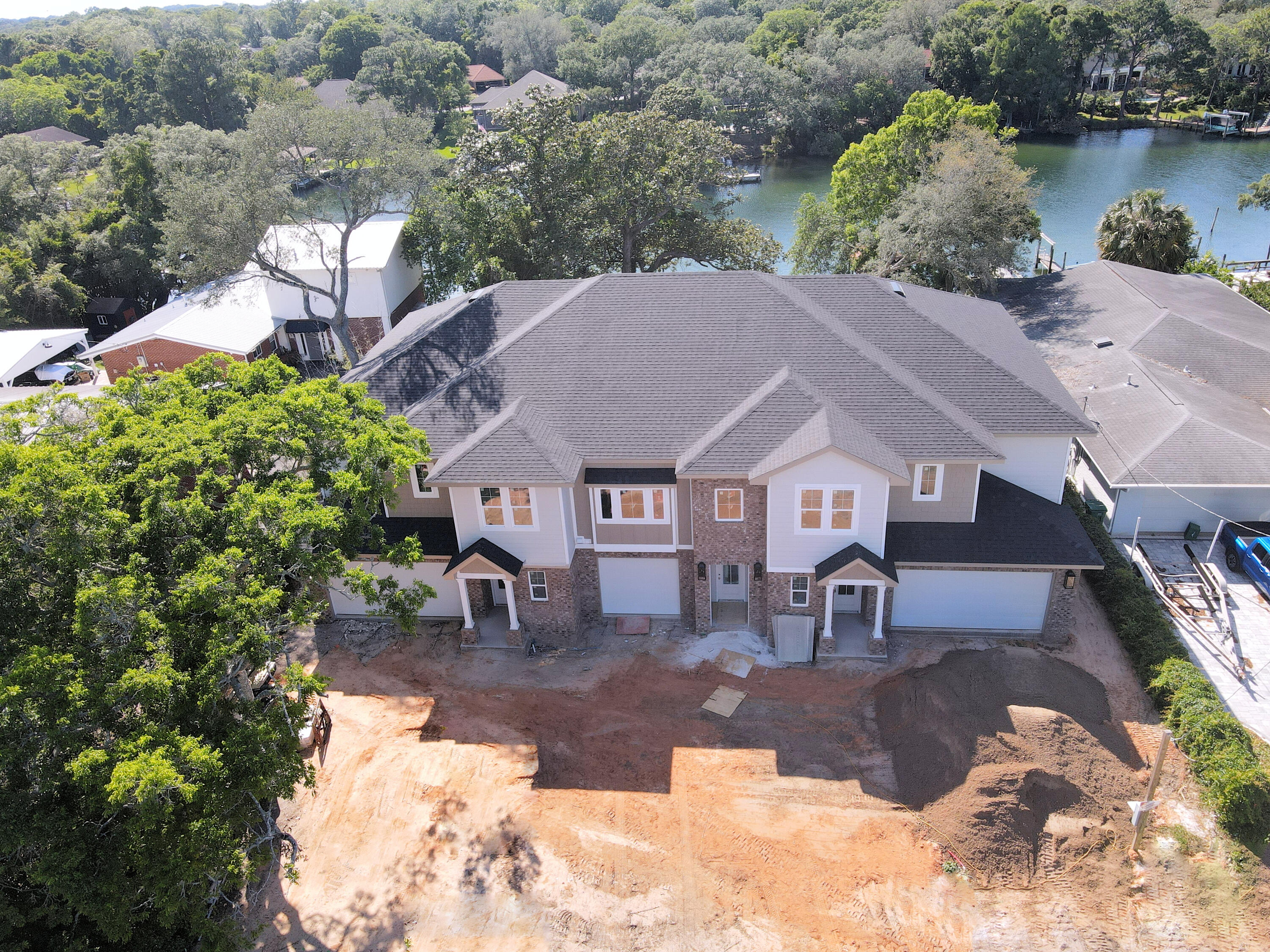 Discover waterfront living at Cinco Trace, a newly constructed townhome with deeded boat slips in the heart of Fort Walton Beach. With all three residences available for individual purchase or as a package, this is a unique opportunity to own brand-new construction along the water. Unit 2 features an open-concept main level with a spacious kitchen and large living room. The master suite, along with two other bedrooms, is located on the second floor alongside a lounge area.